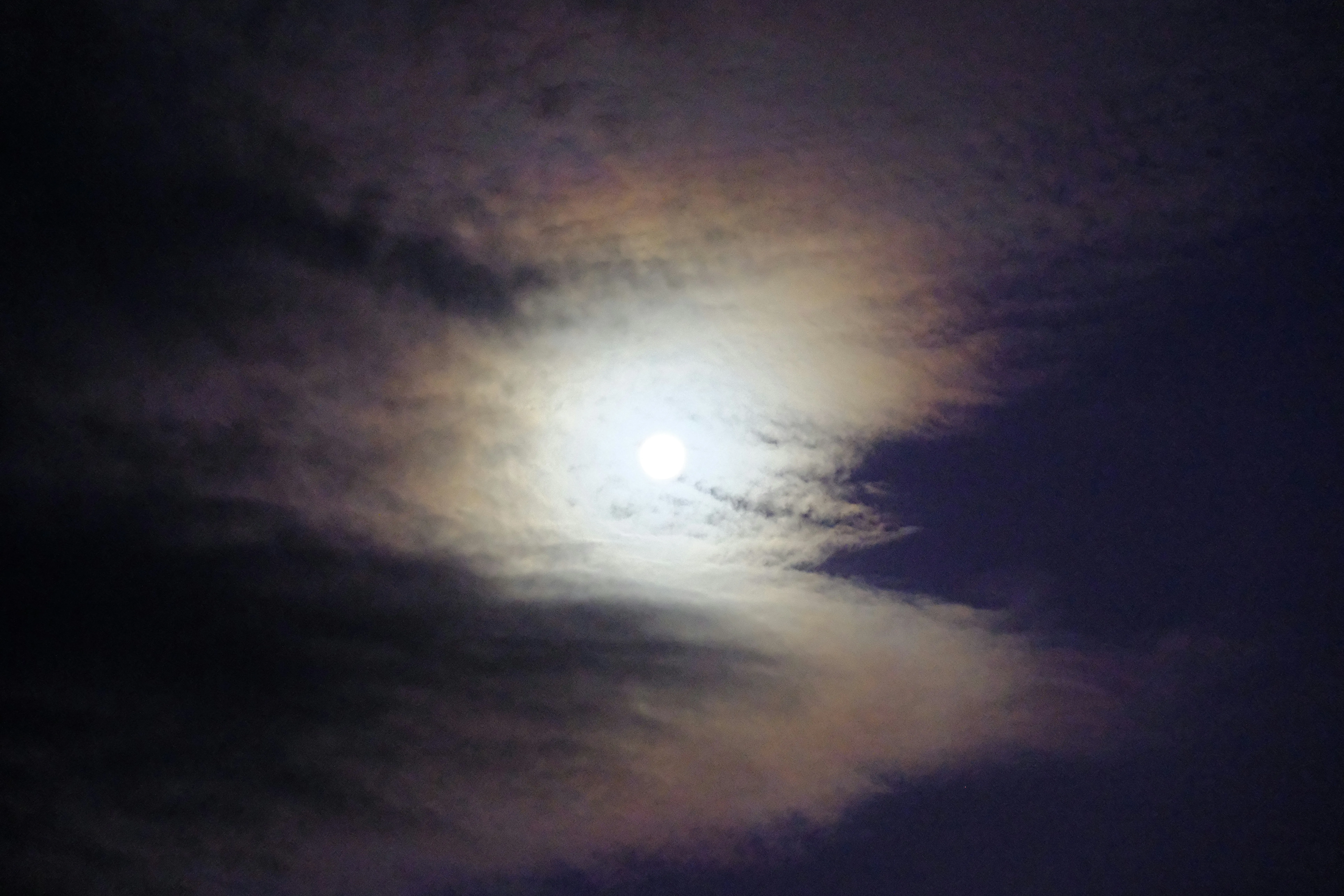 Moon and Night Clouds Blending Into a Surreal Sky Scene
