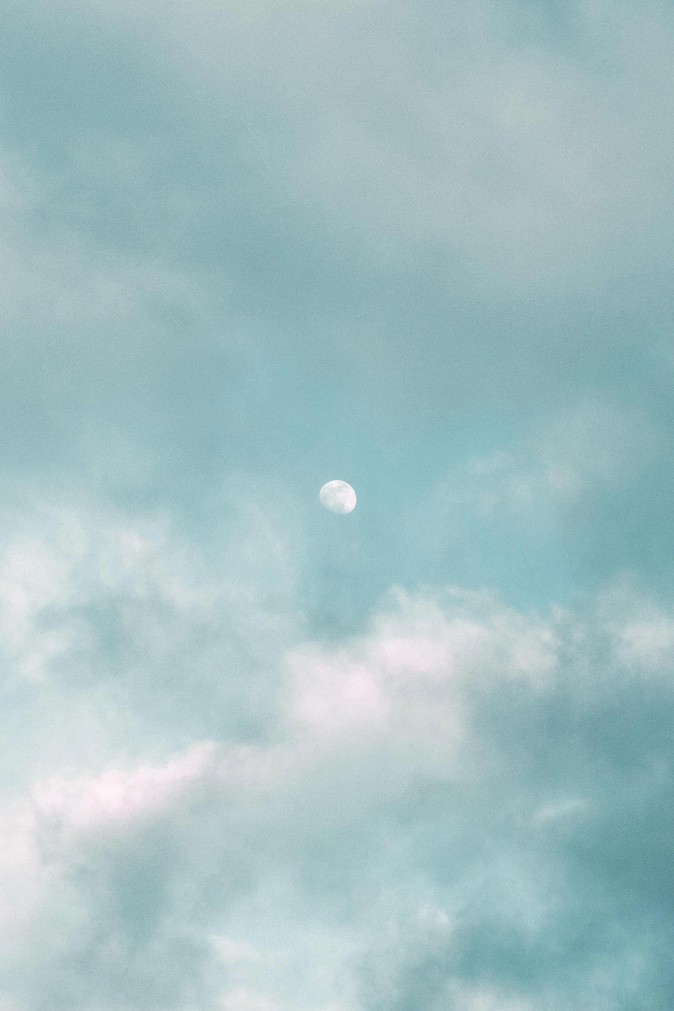 Moon Visible Through Light Blue Cloud Cover Wallpaper