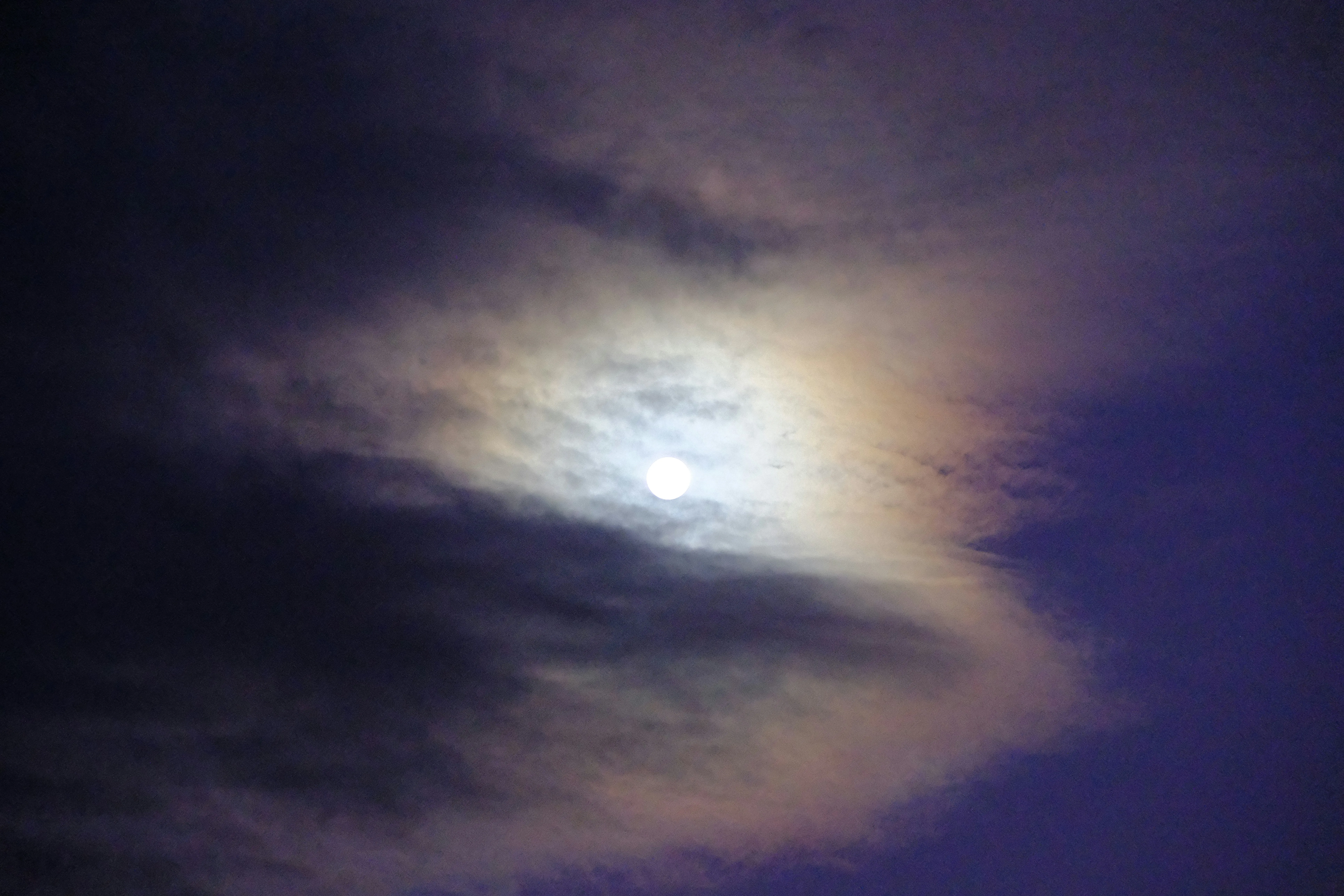 Moonlight Breaking Through Thick Evening Cloud Layers