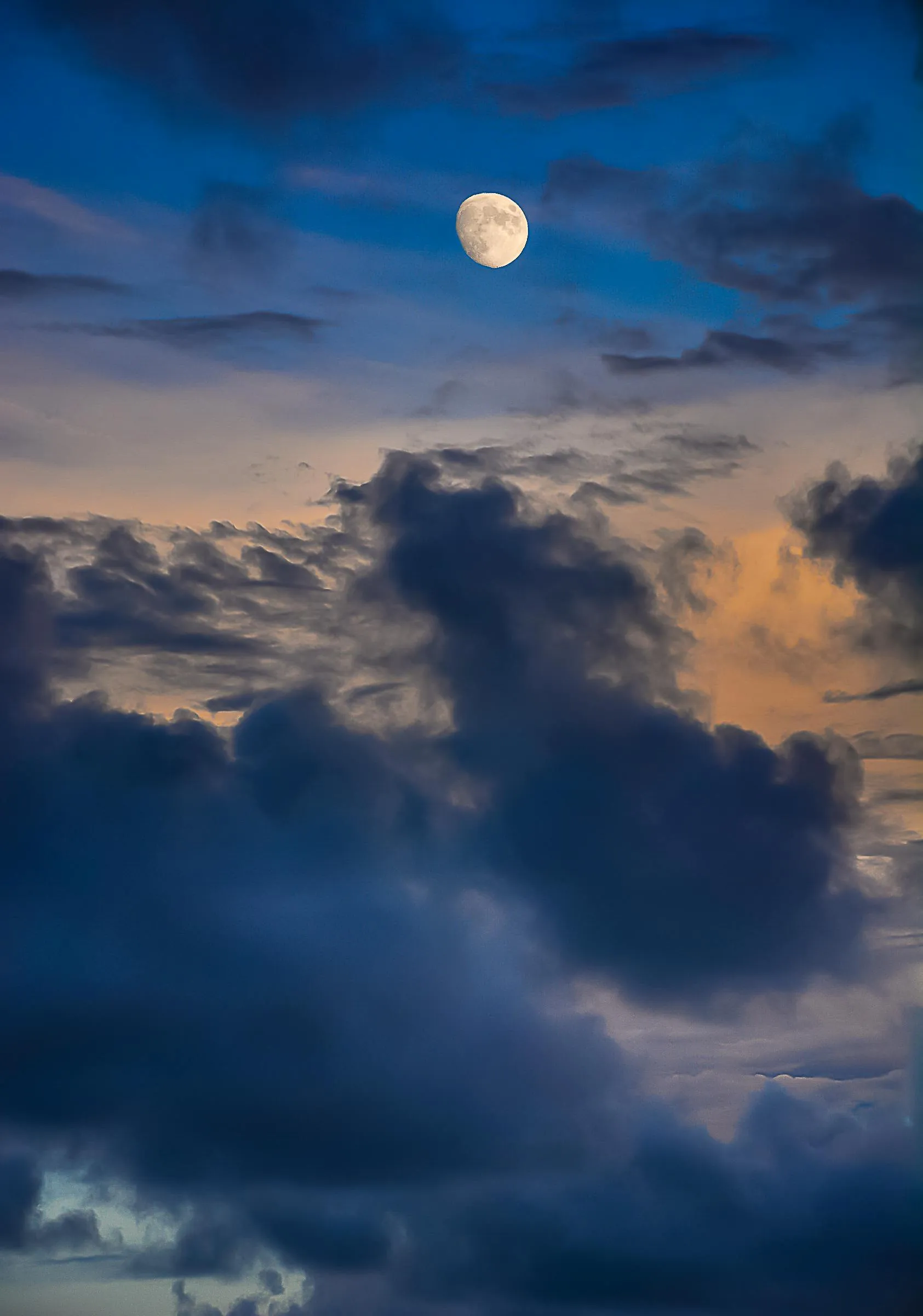 Moonlit Sky with Dark Clouds Creating a Mysterious Scene