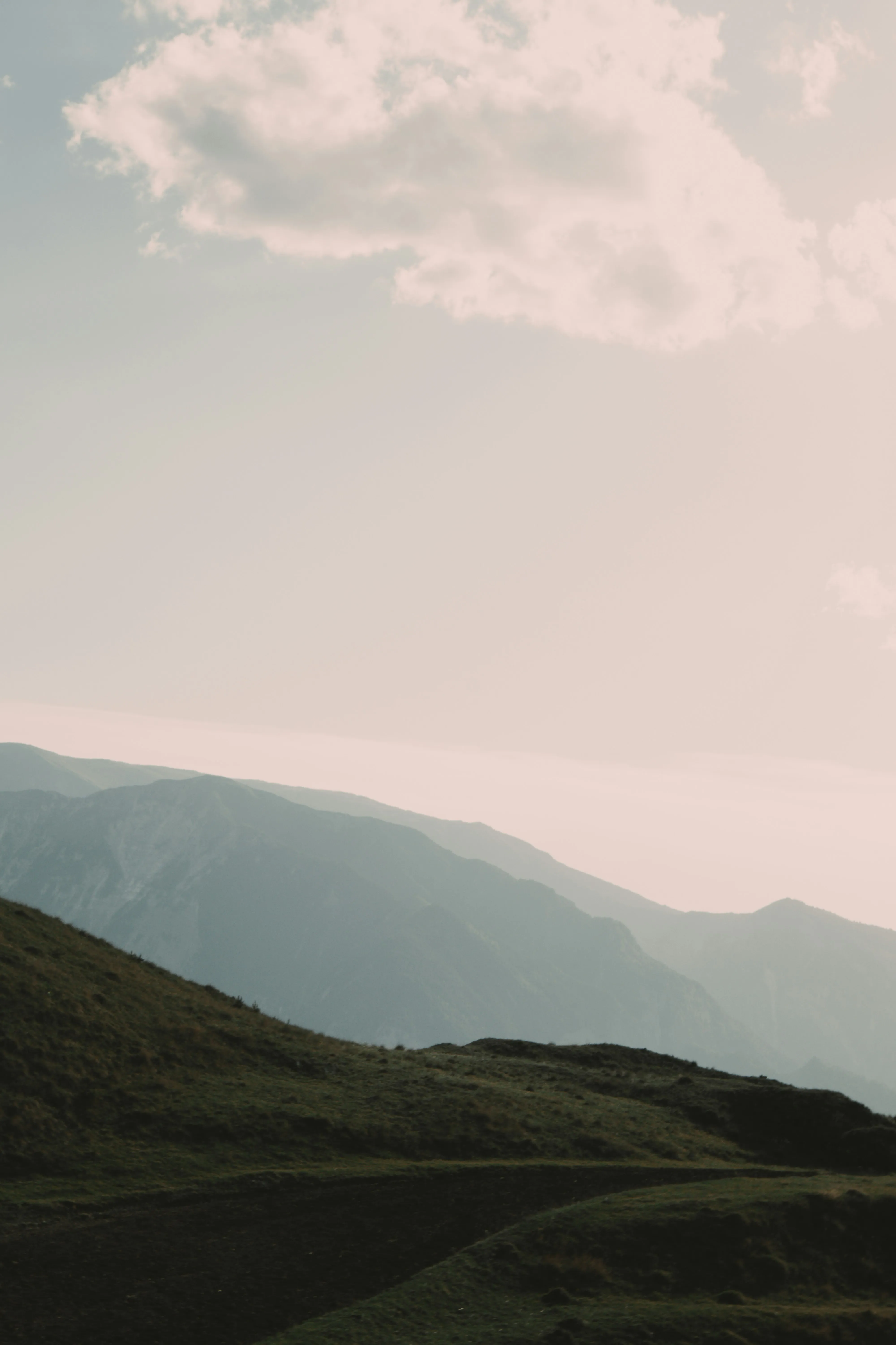 Mountain Hills with Soft Pastel Sky and Clouds Image