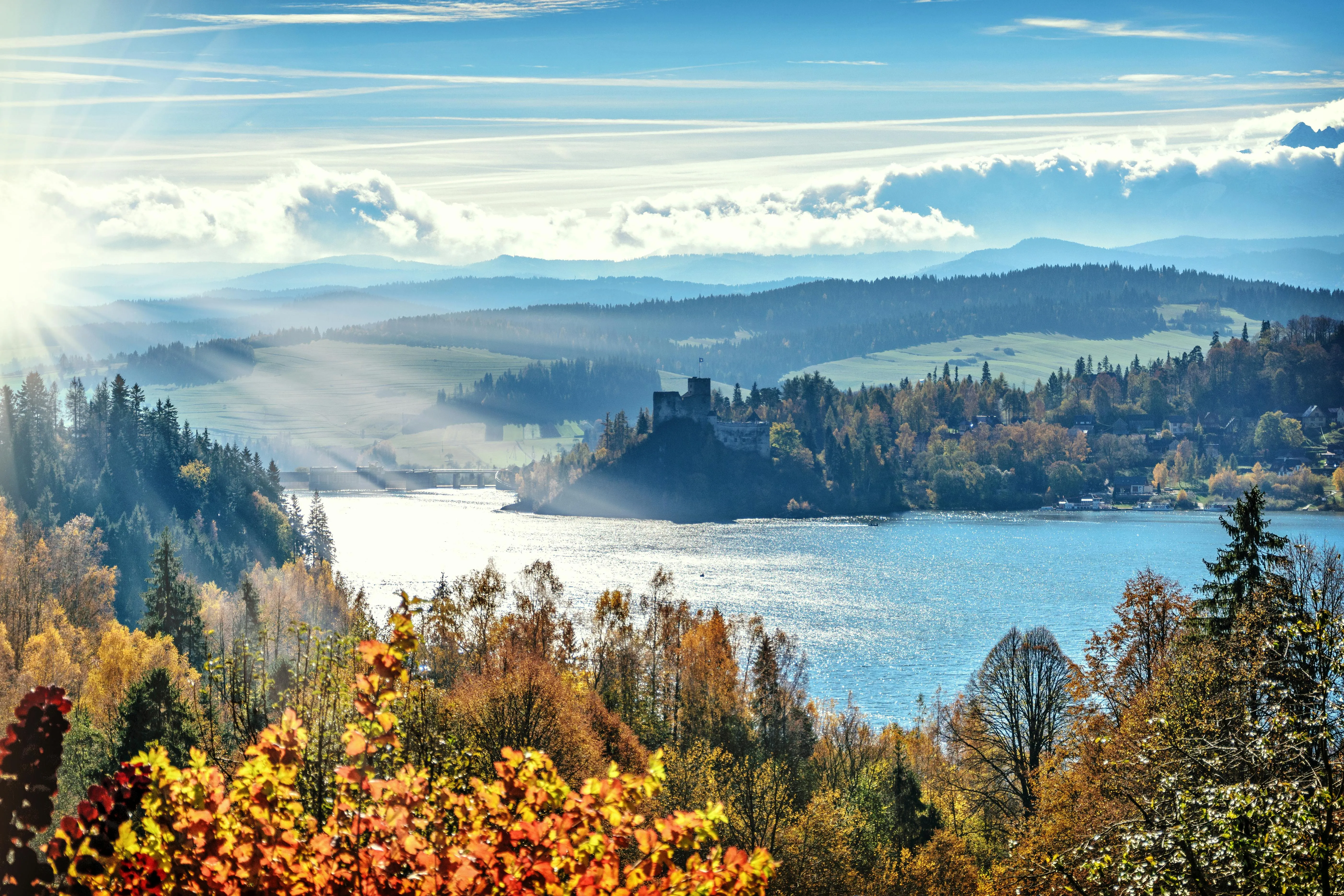 Mountain Lake and Forest Landscape Under Bright Skies