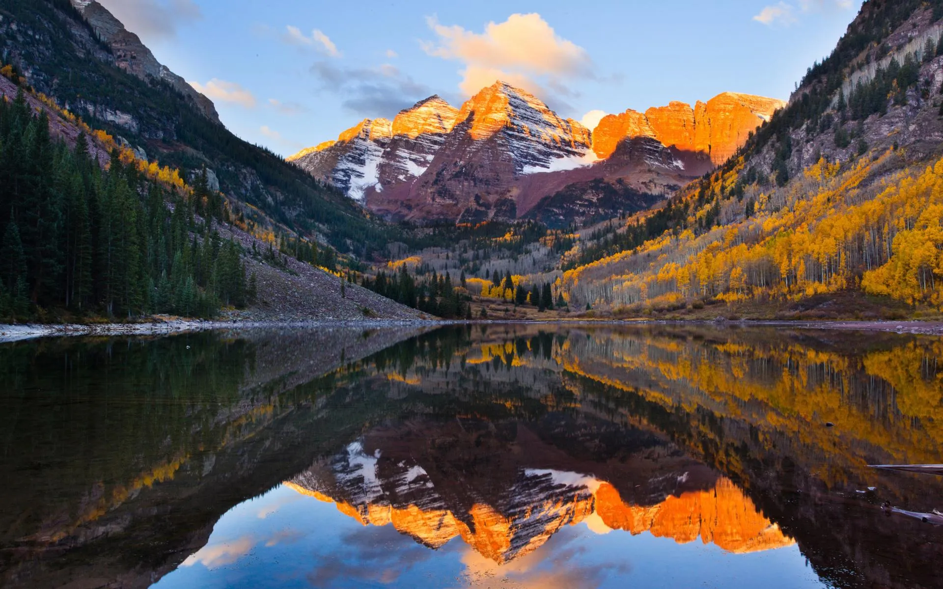 Mountain lake reflecting rugged snowcapped peaks image