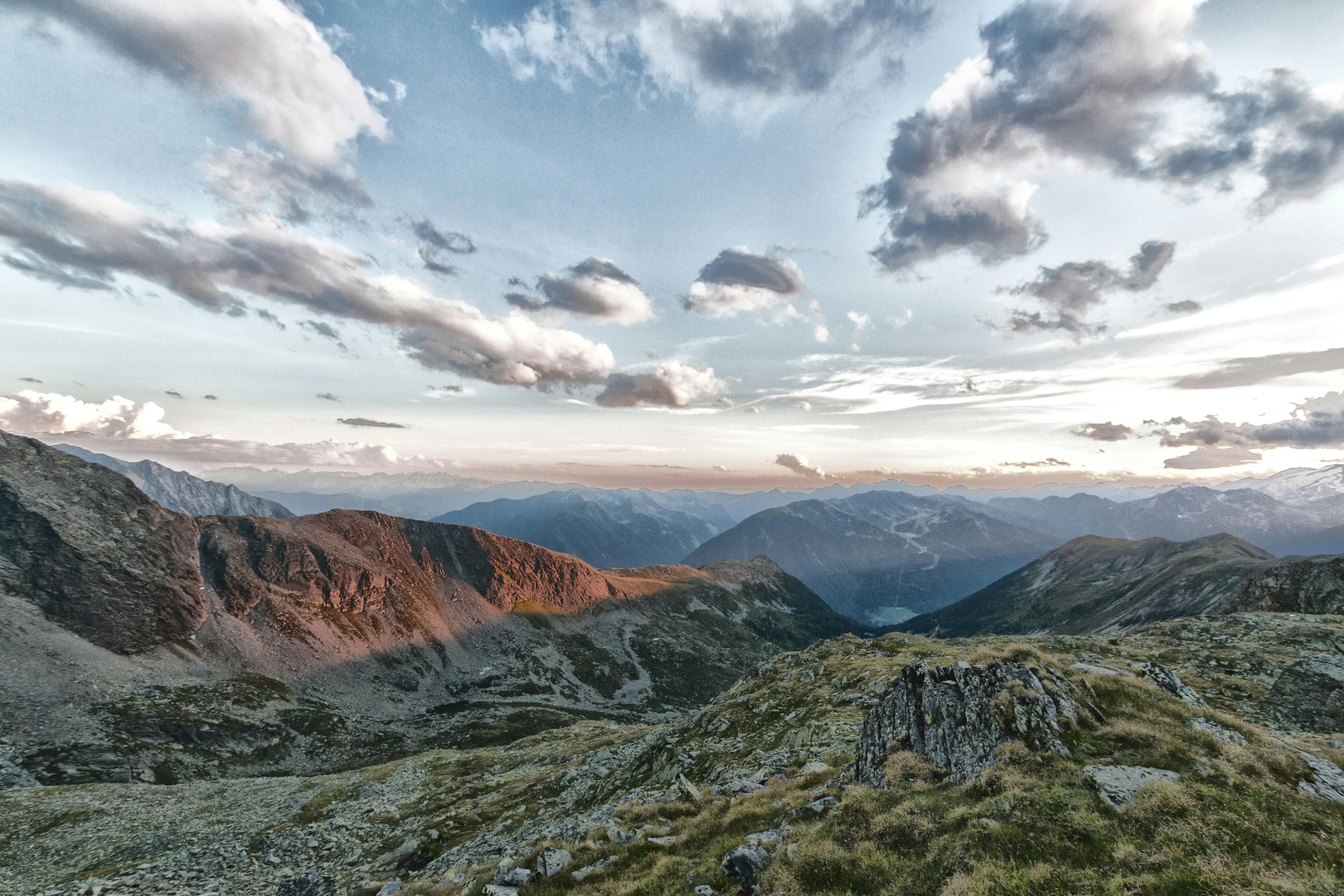 Mountain Landscape with Cloud Filled Sky in Soft Light