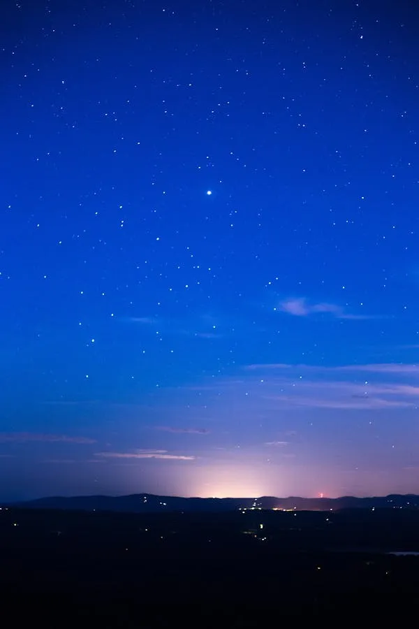 Night Sky Over a Quiet Town with Stars Visible Wallpaper