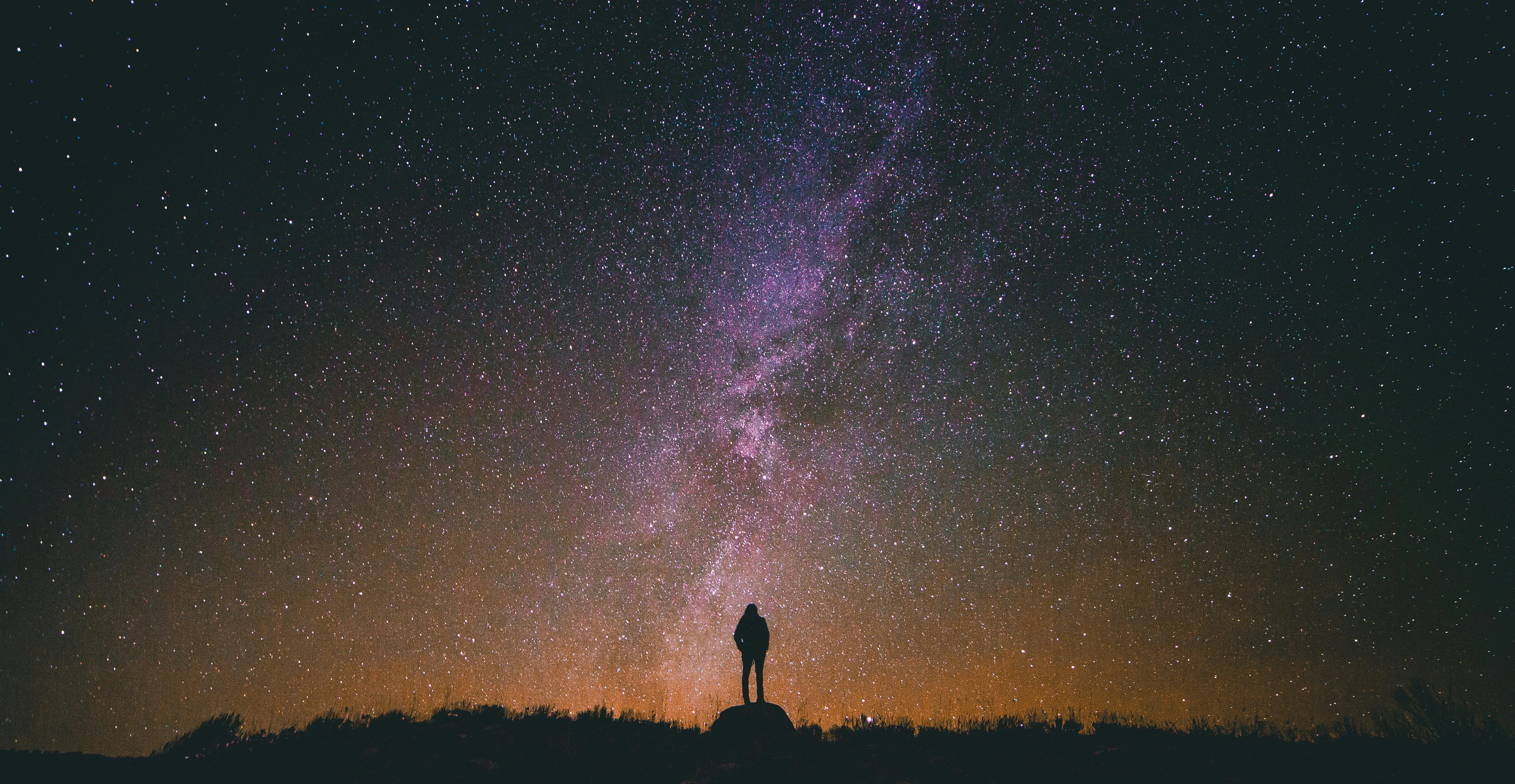 Night Sky with Milky Way and Person Silhouetted on Horizon