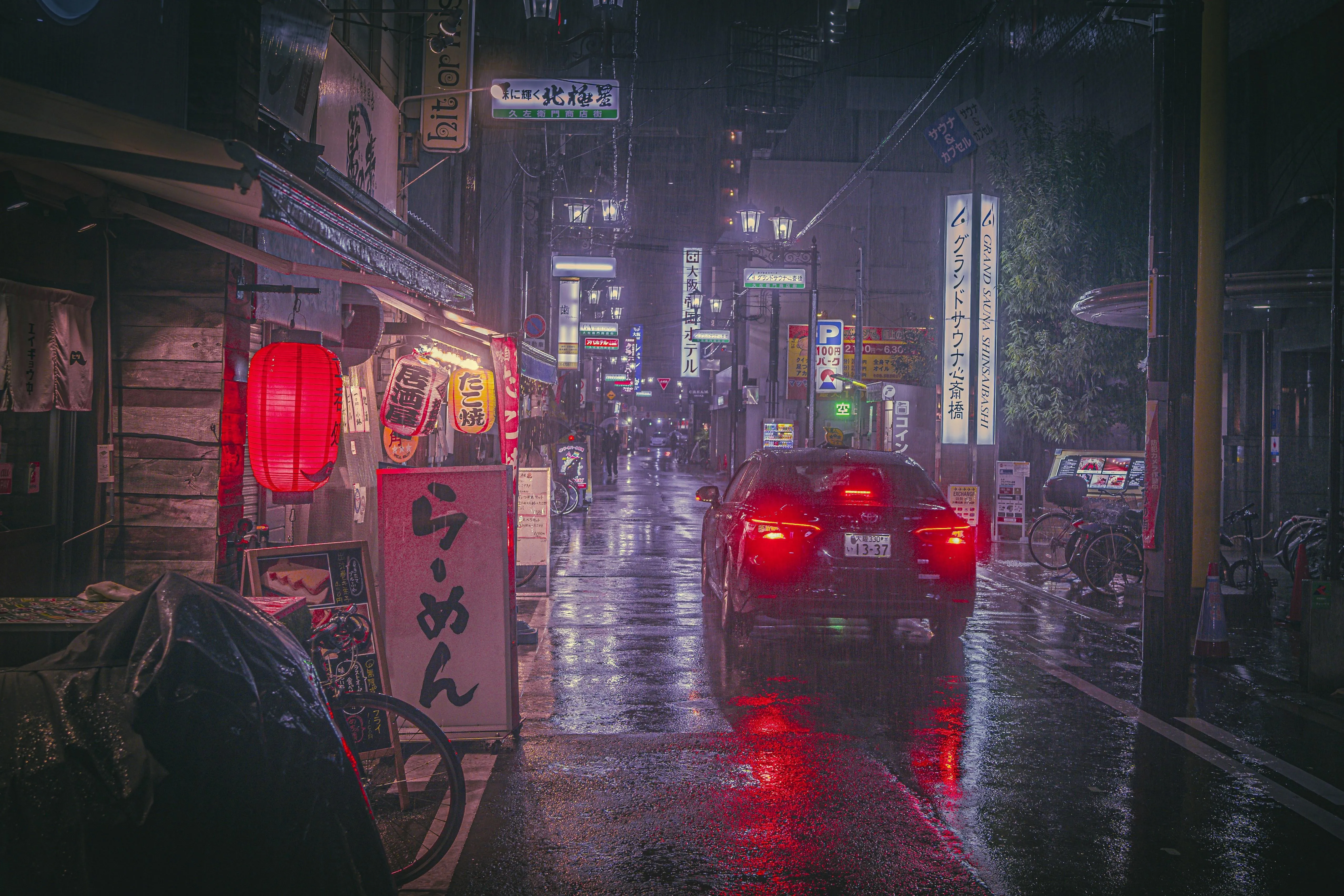 Night Traffic Through Wet Window in Heavy Rainfall
