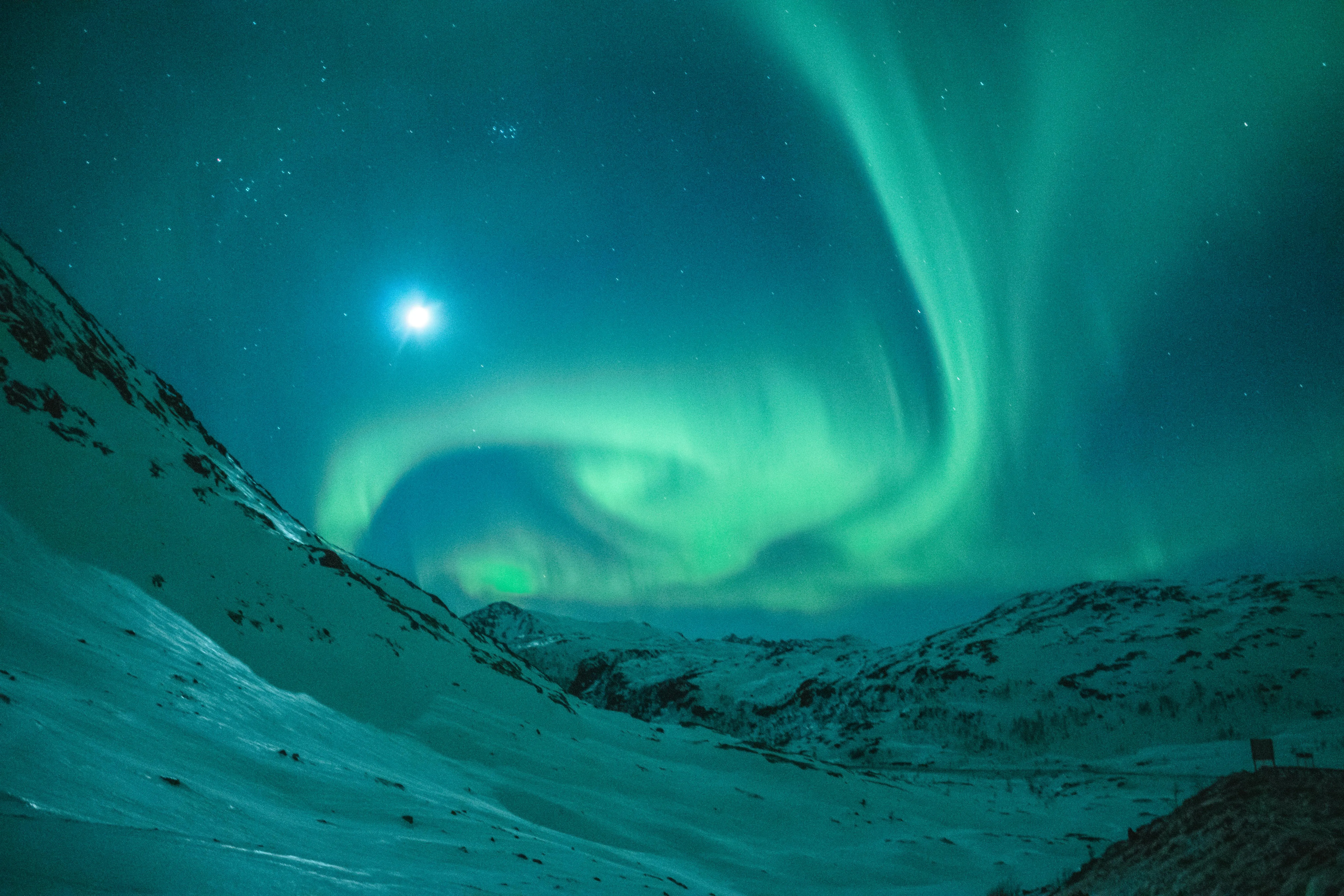 Northern Lights Glowing in a Dark Arctic Sky Wallpaper