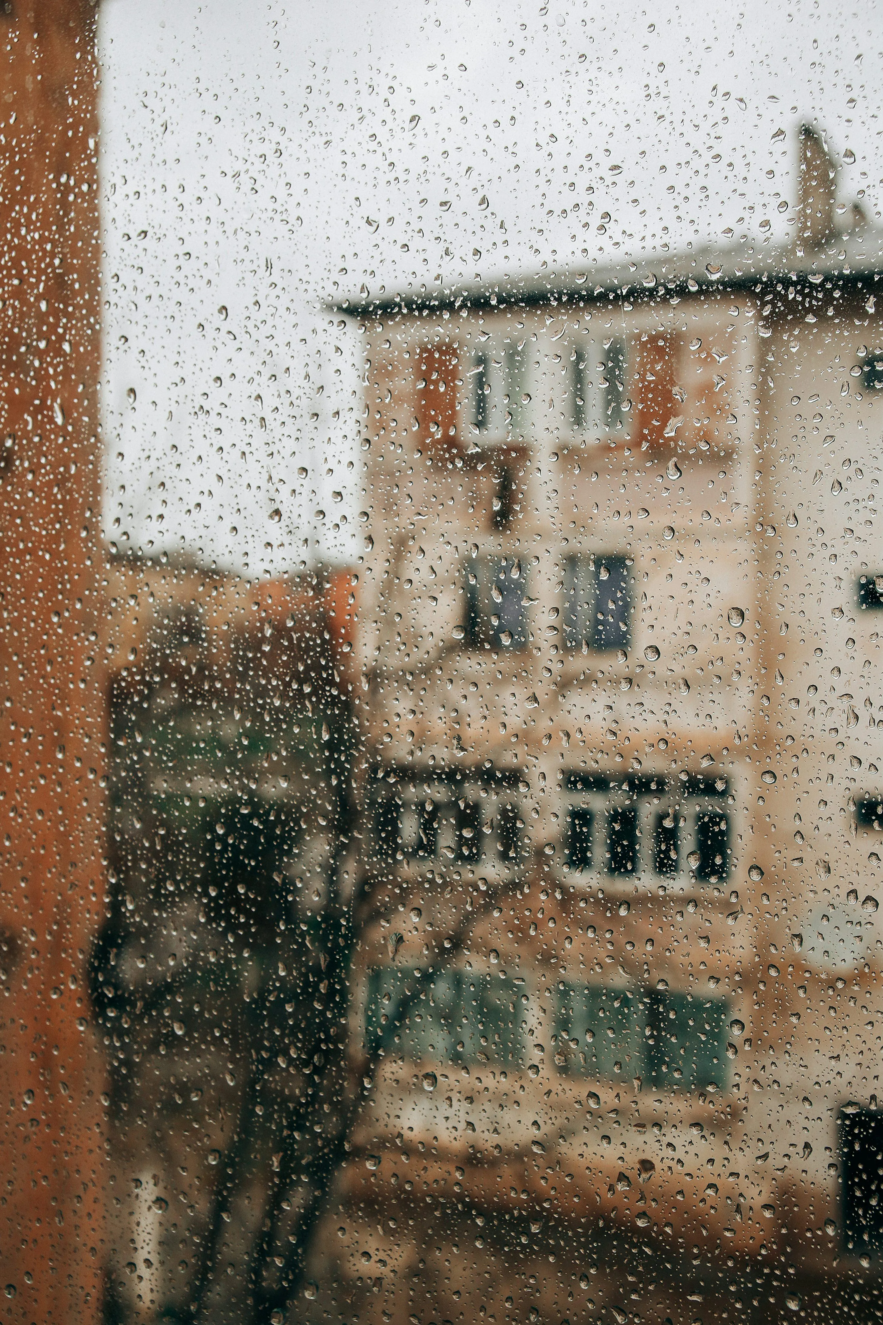 Old Apartment Building During Light Rainfall Image