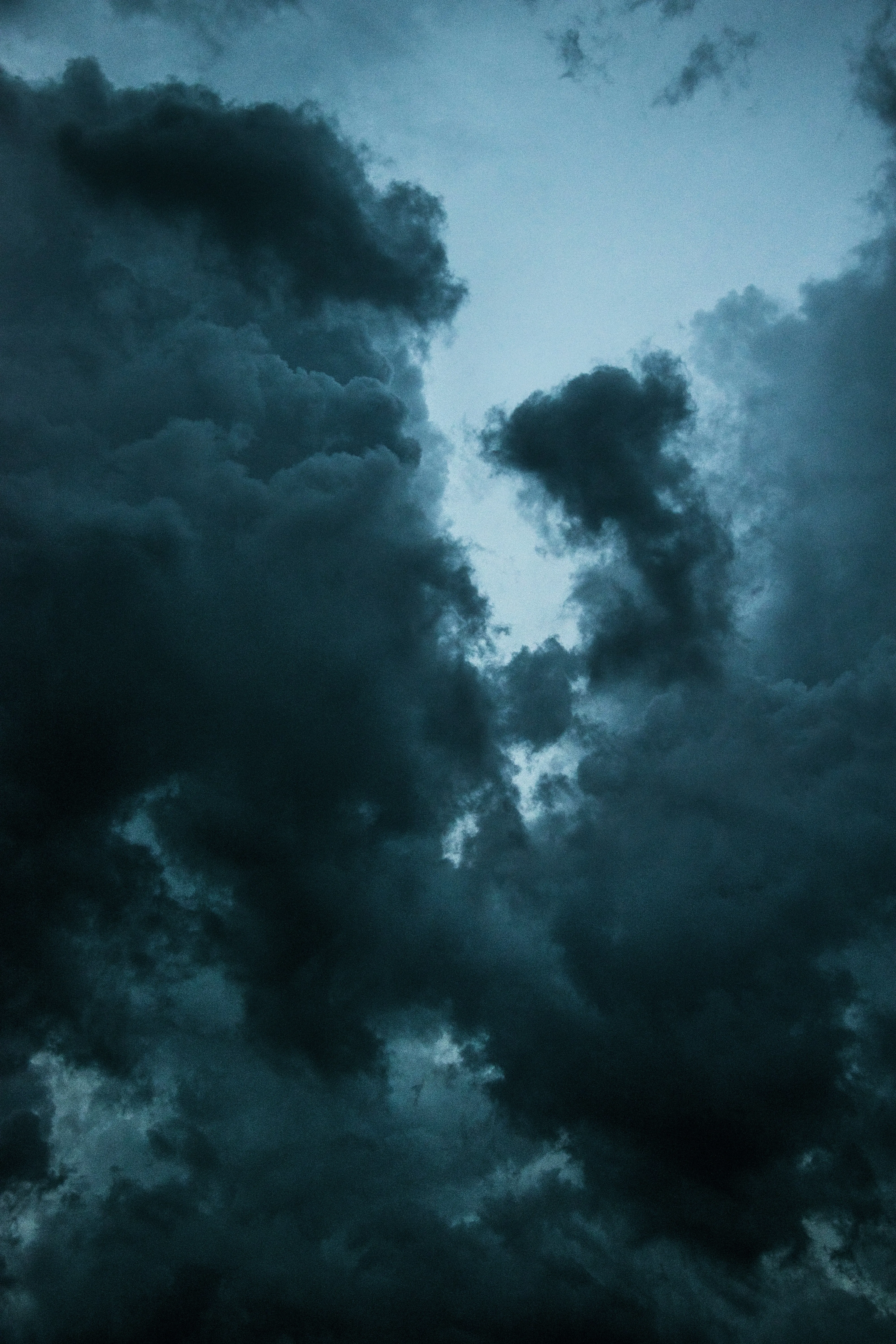 Ominous Dark Blue Clouds Swirling in a Stormy Sky