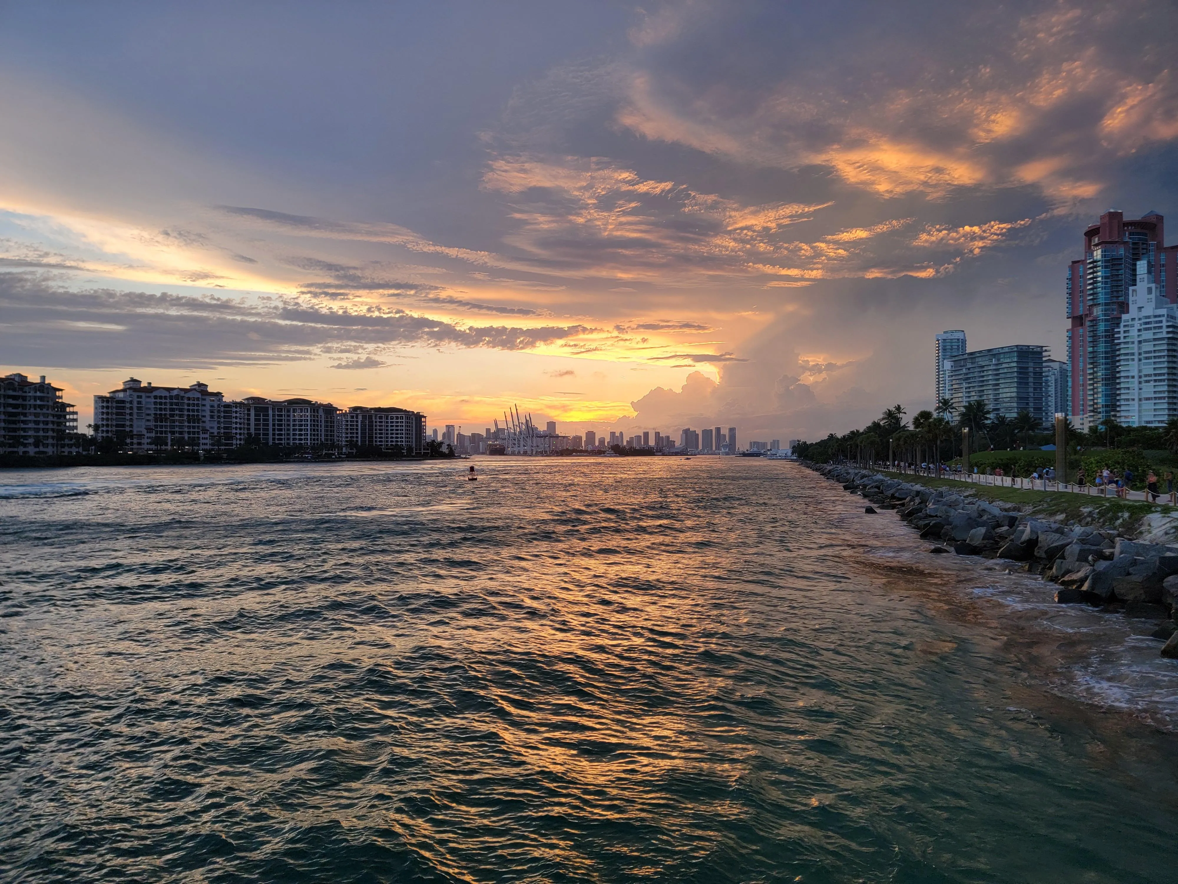 Orange and purple sunset over calm water free HD image