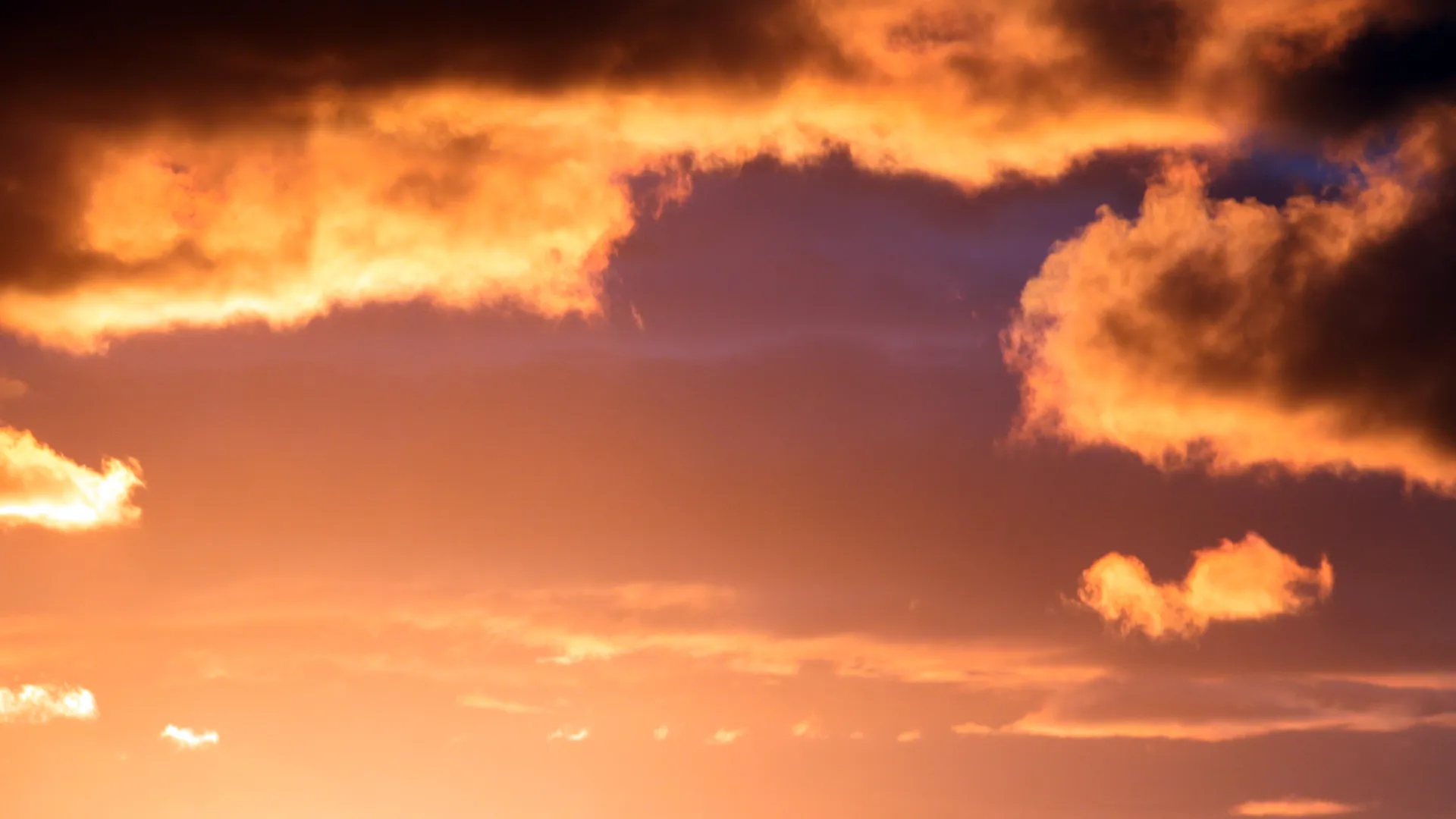 Orange Cloud Formation Glowing in the Evening Sky Image