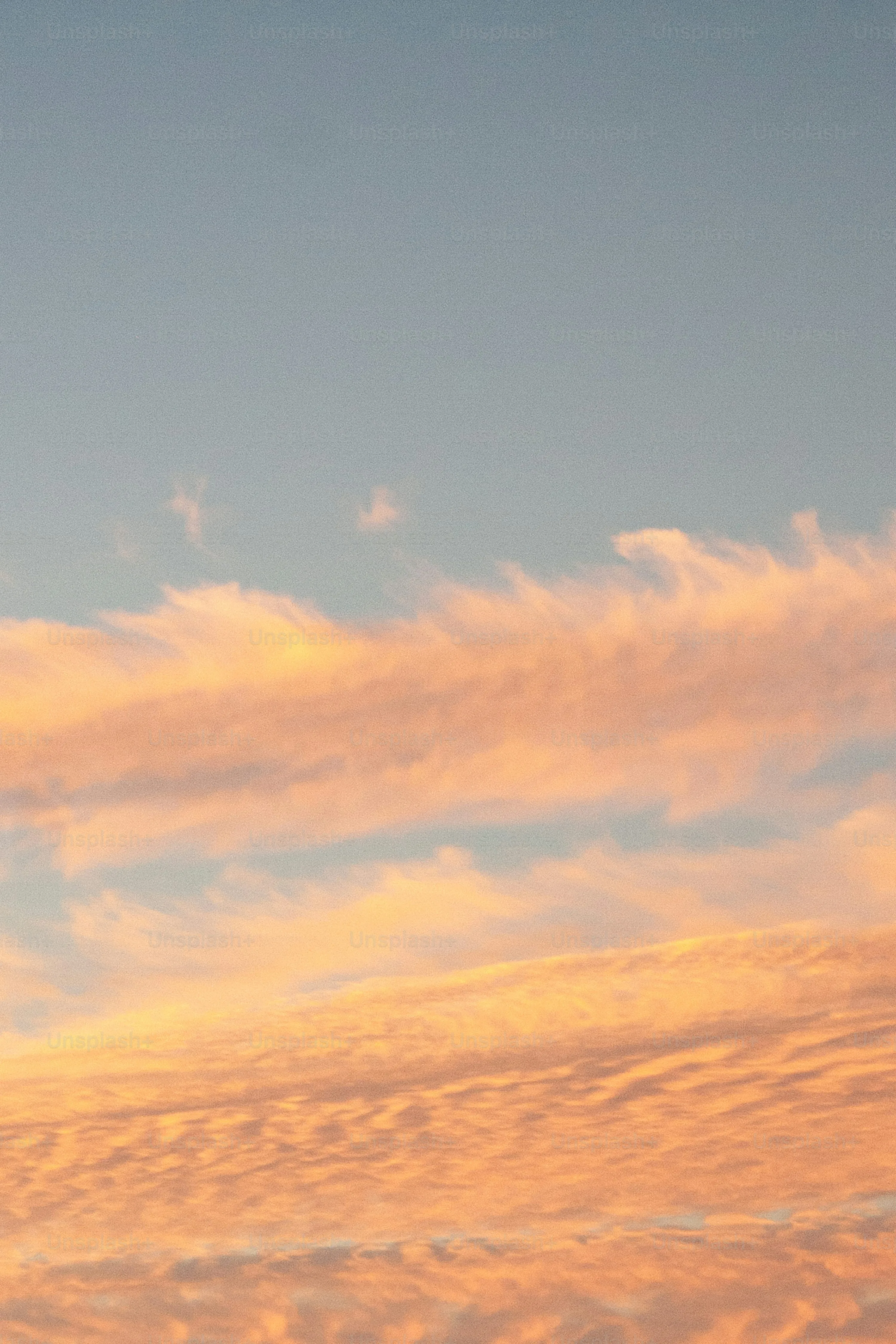 Orange Sky with Soft Clouds During a Peaceful Sunset