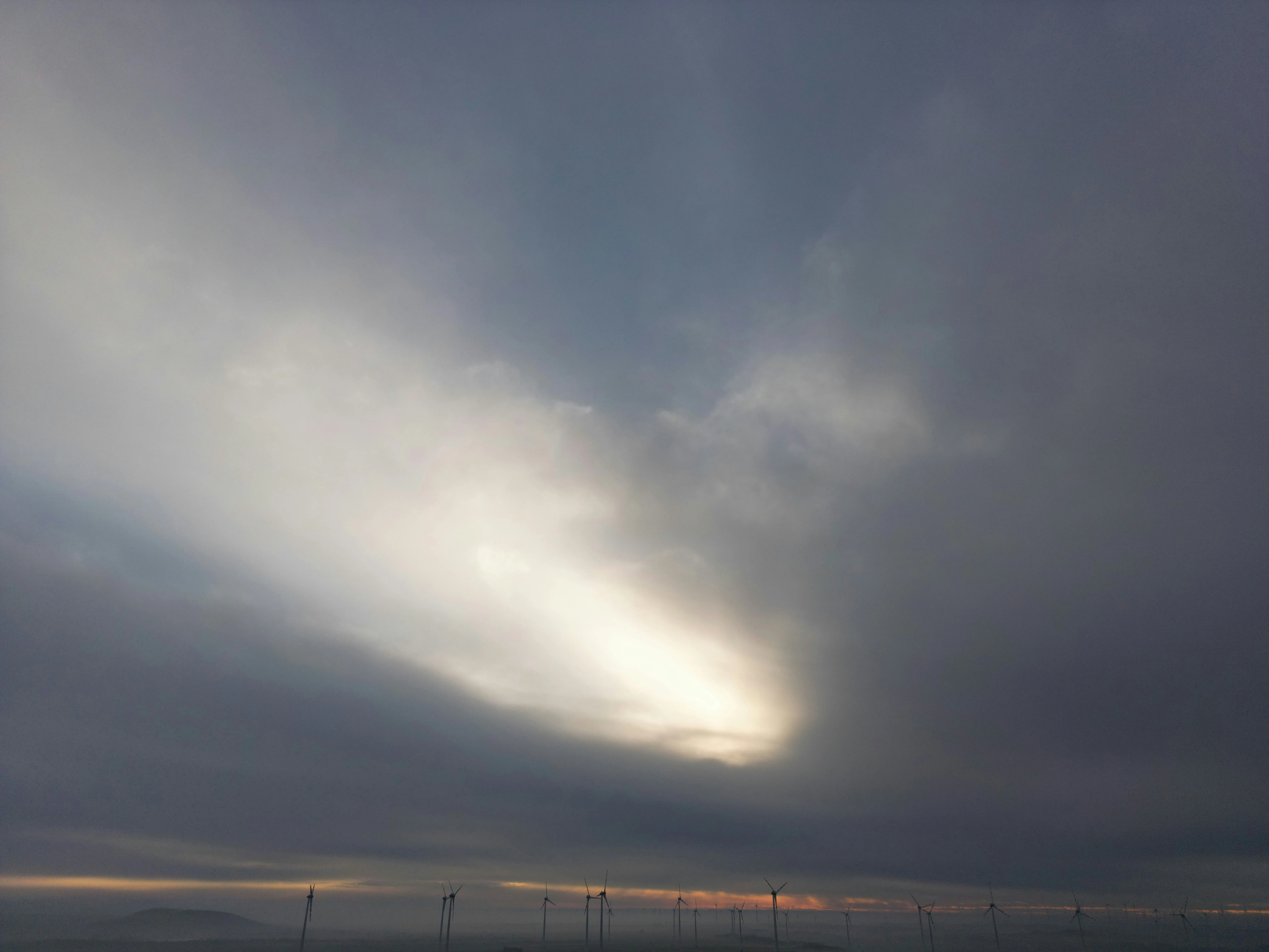 Overcast Sky with Sun Rays Filtering Through Dense Clouds