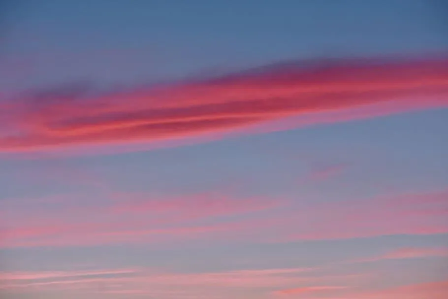 Pastel Sky with Pink and Purple Clouds at Dusk Wallpaper