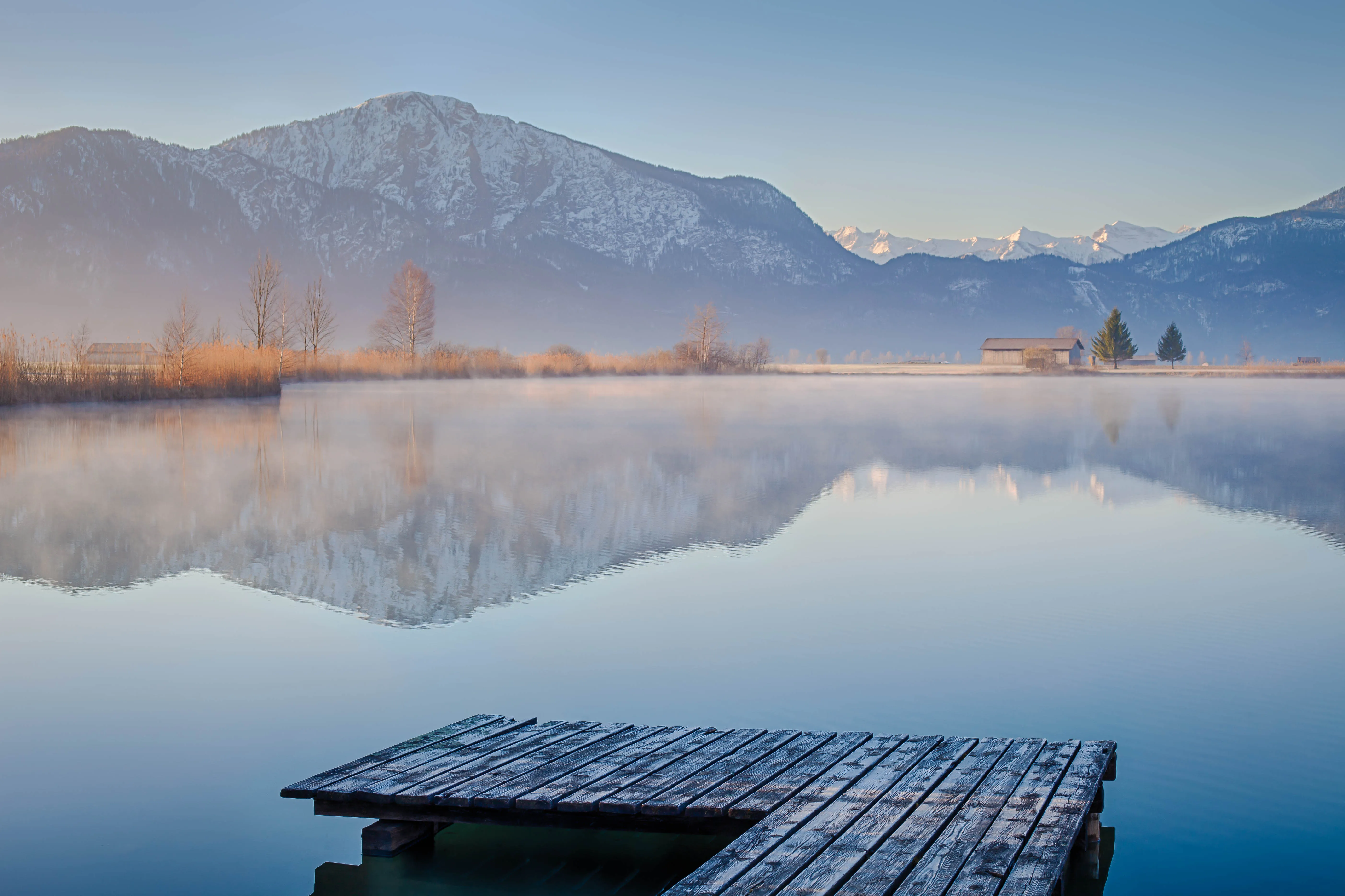 Peaceful Morning Scene with Lake and Wooden Dock Image