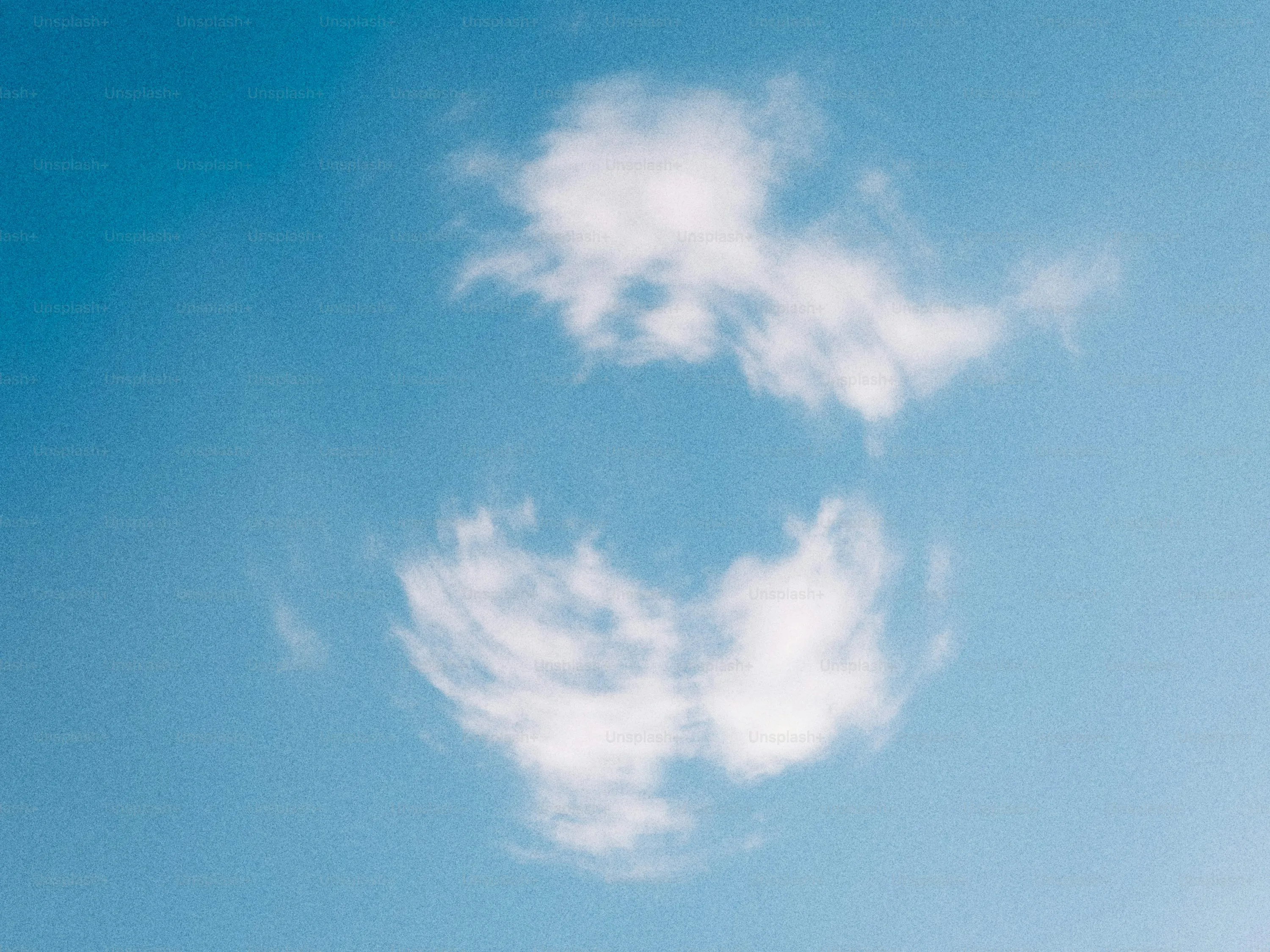 Perfectly Round Cloud Floating in Bright Sky Wallpaper