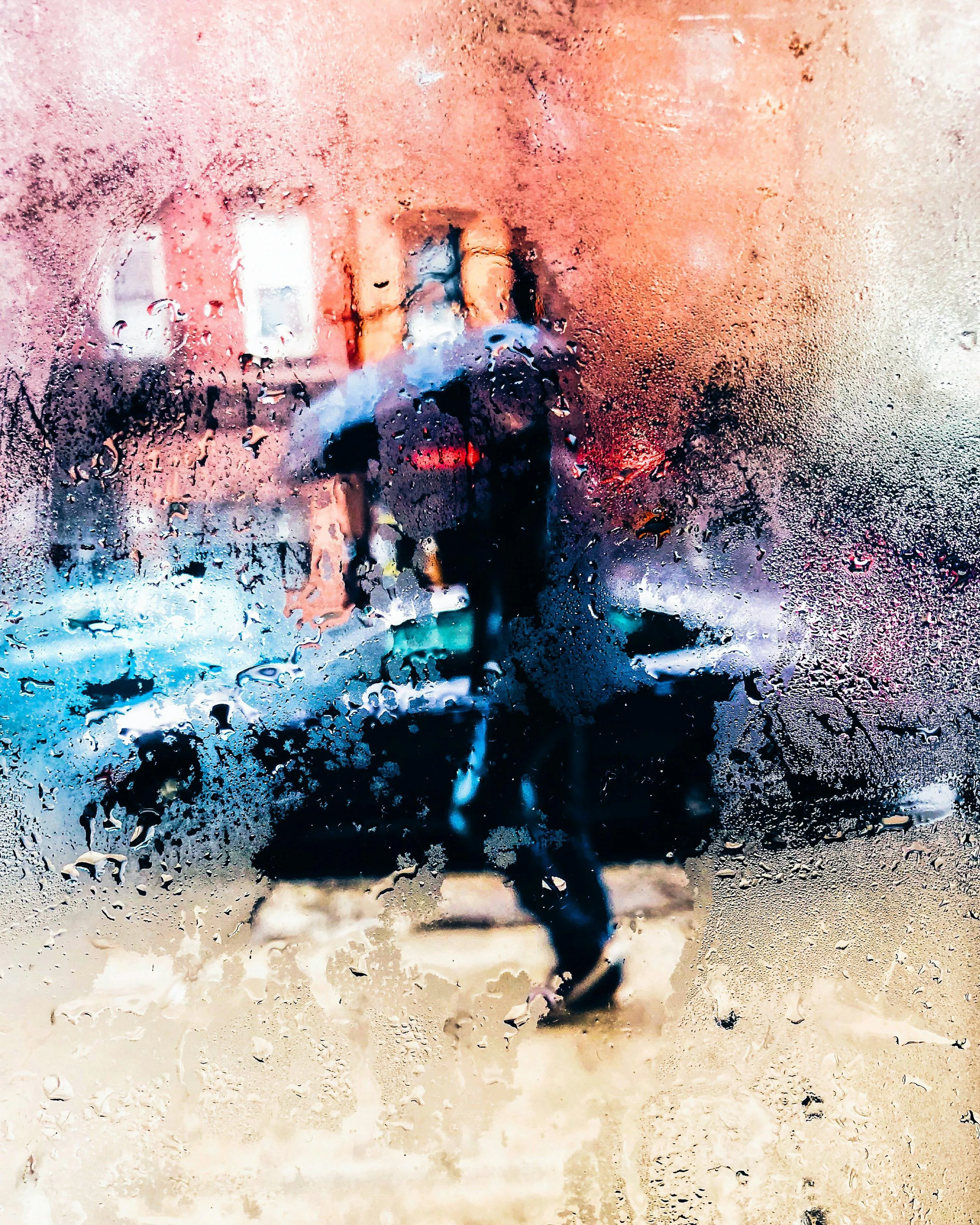 Person with Umbrella Running Through Rainy Street Wallpaper