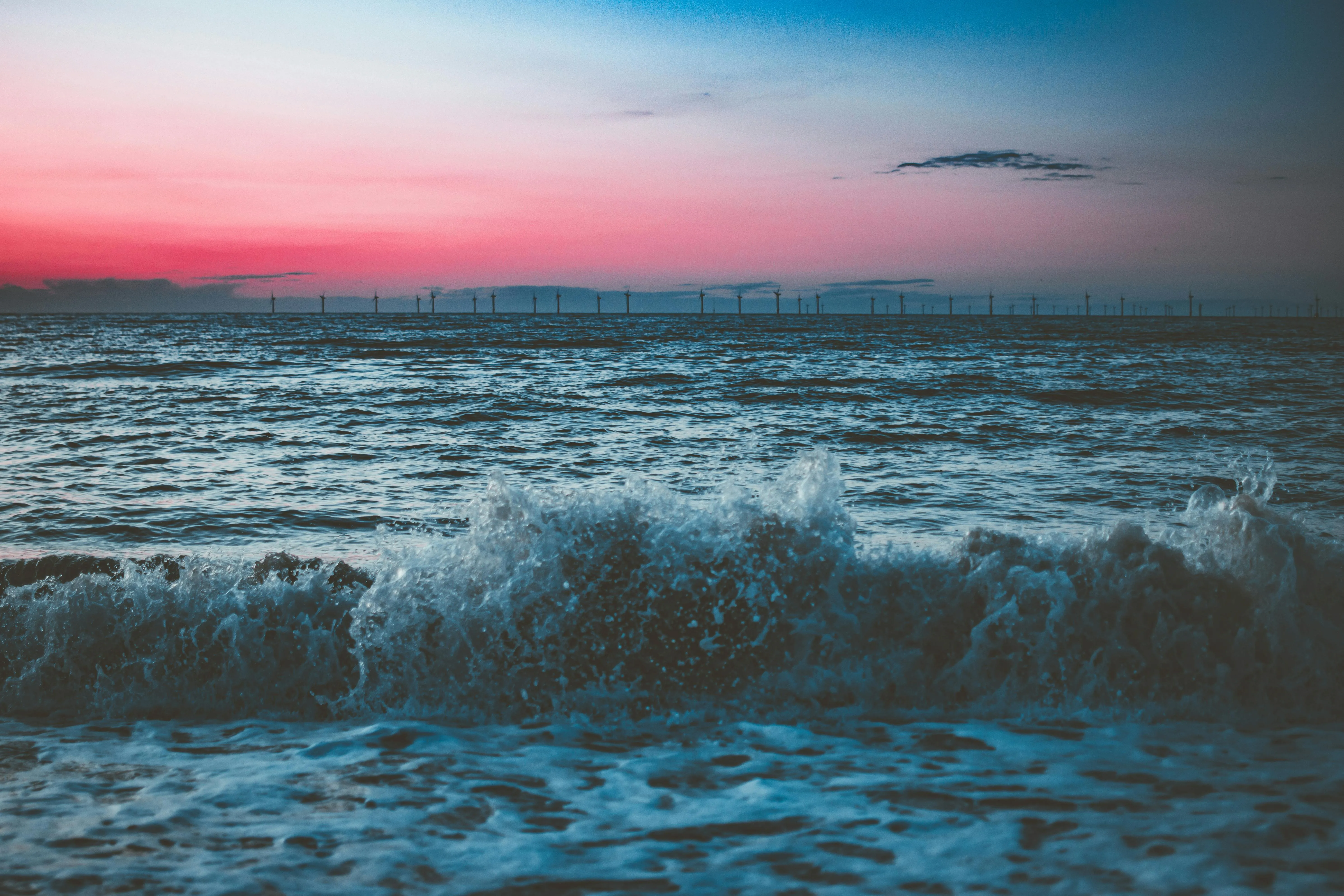 Pink and Blue Sky Reflecting on Ocean Waves at Sunset