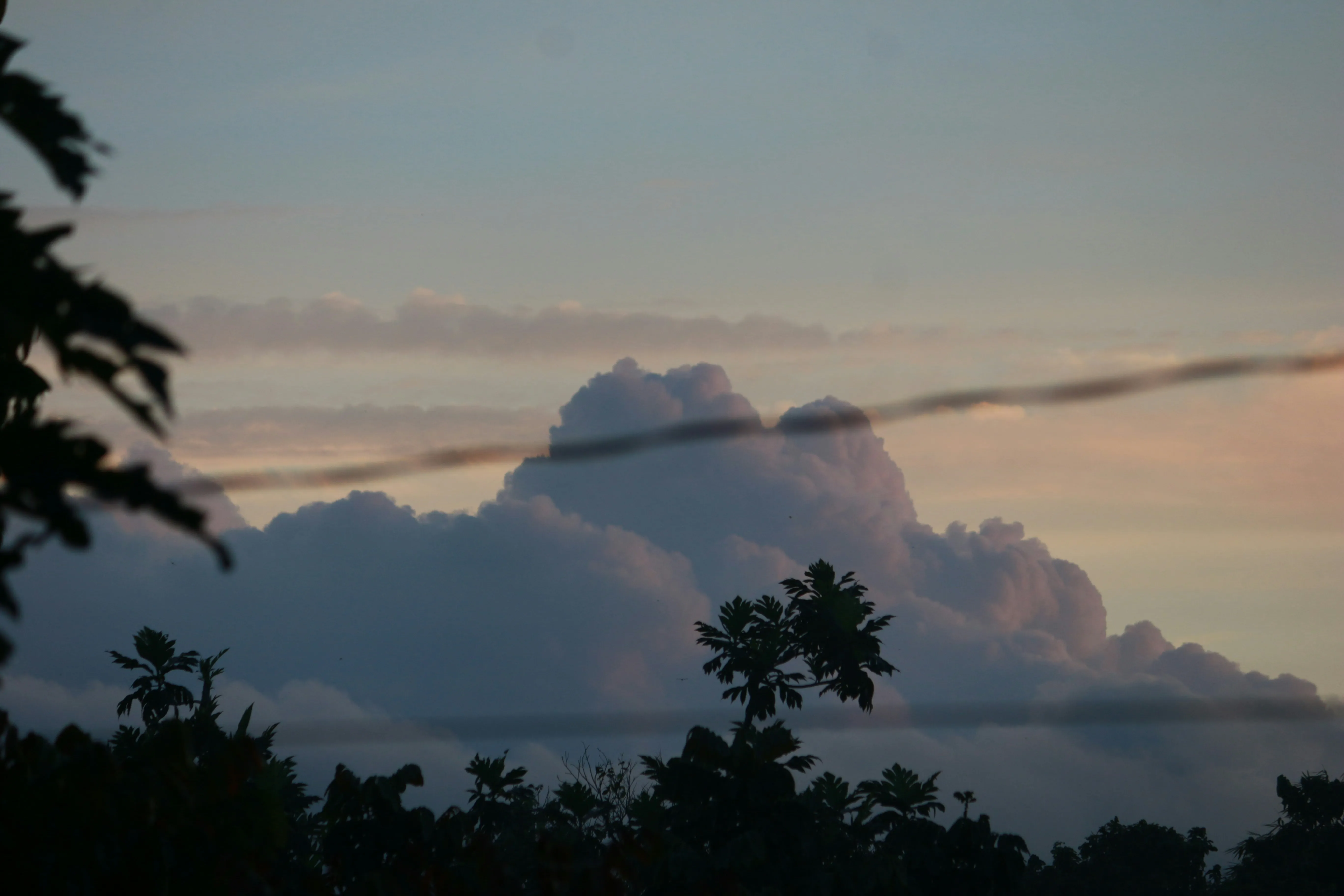 Pink and Gray Clouds Hovering Over Quiet Countryside