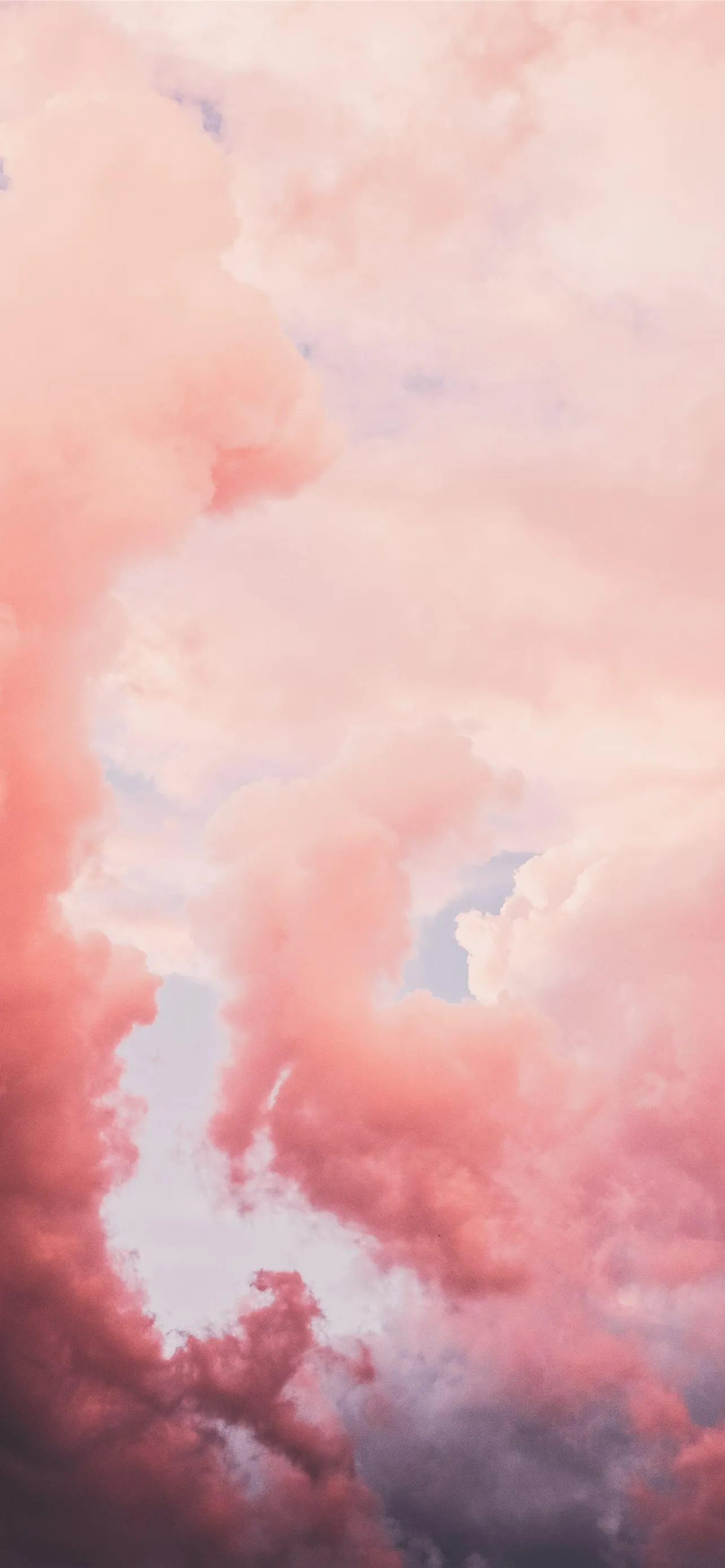 Pink Cloud Formation at Sunset Creating Soft Glow Wallpaper