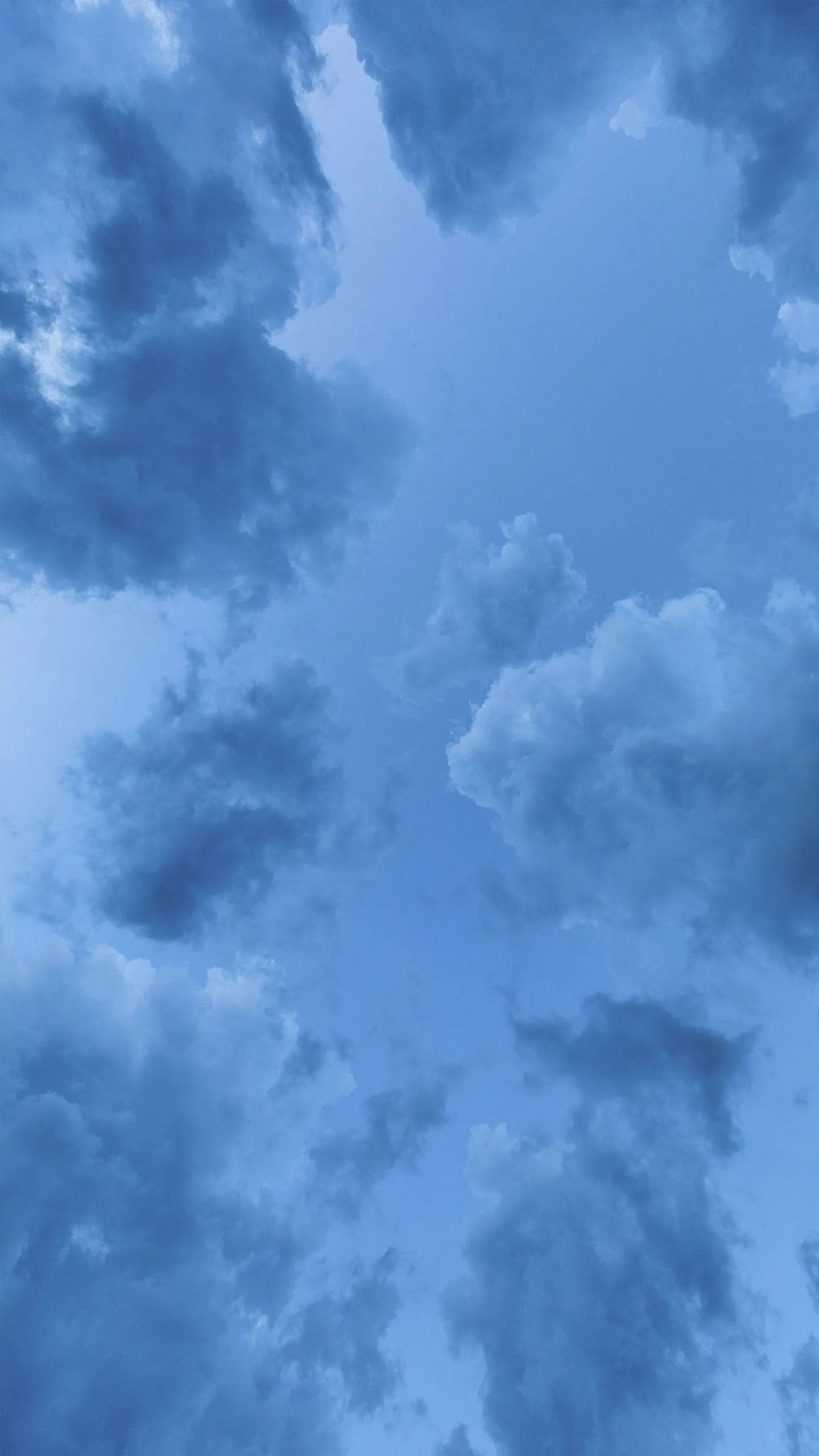 Portrait Image of Massive Cloud Towering High in Blue Sky