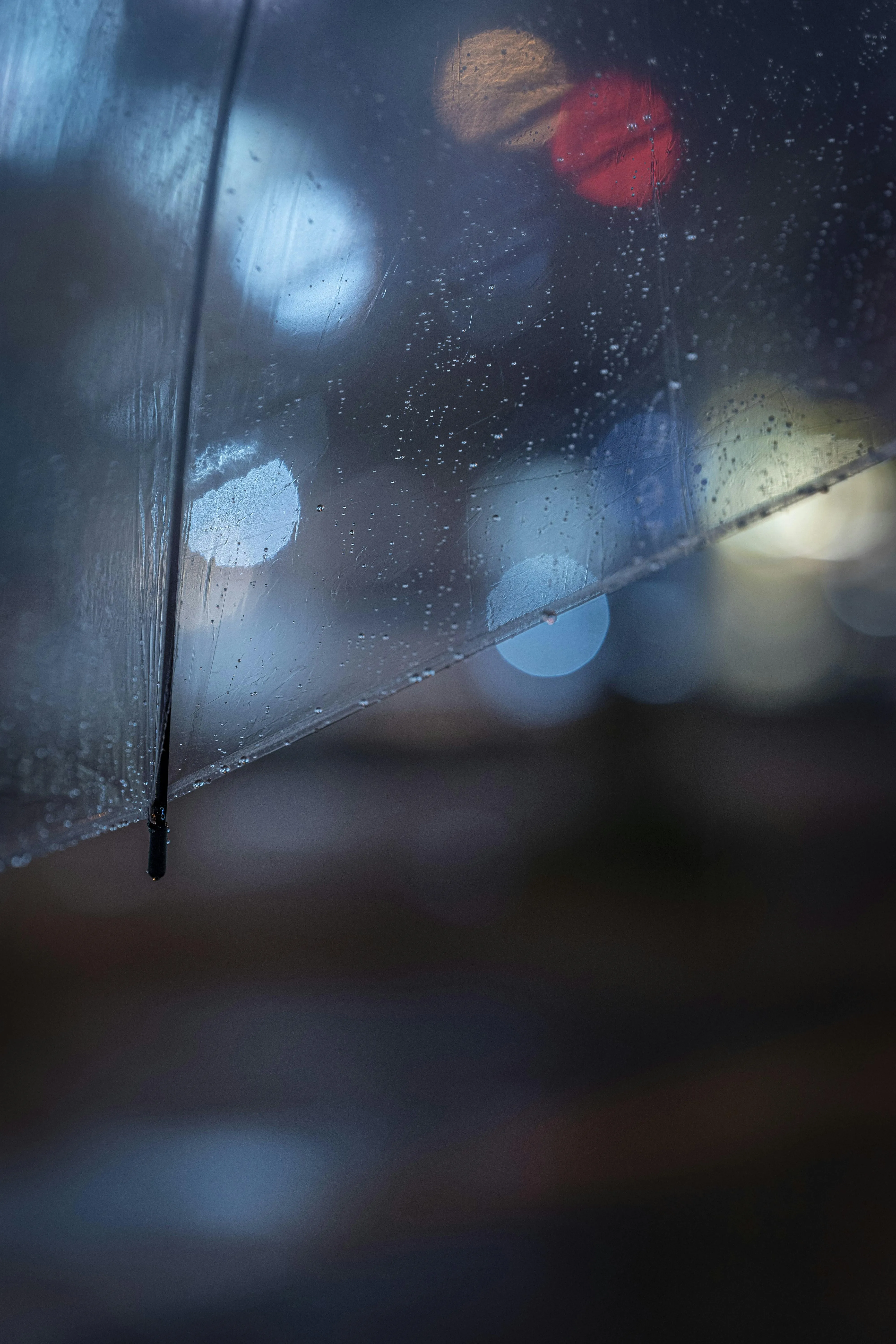 Rain Blurred Blue Light in Nighttime City Setting Wallpaper