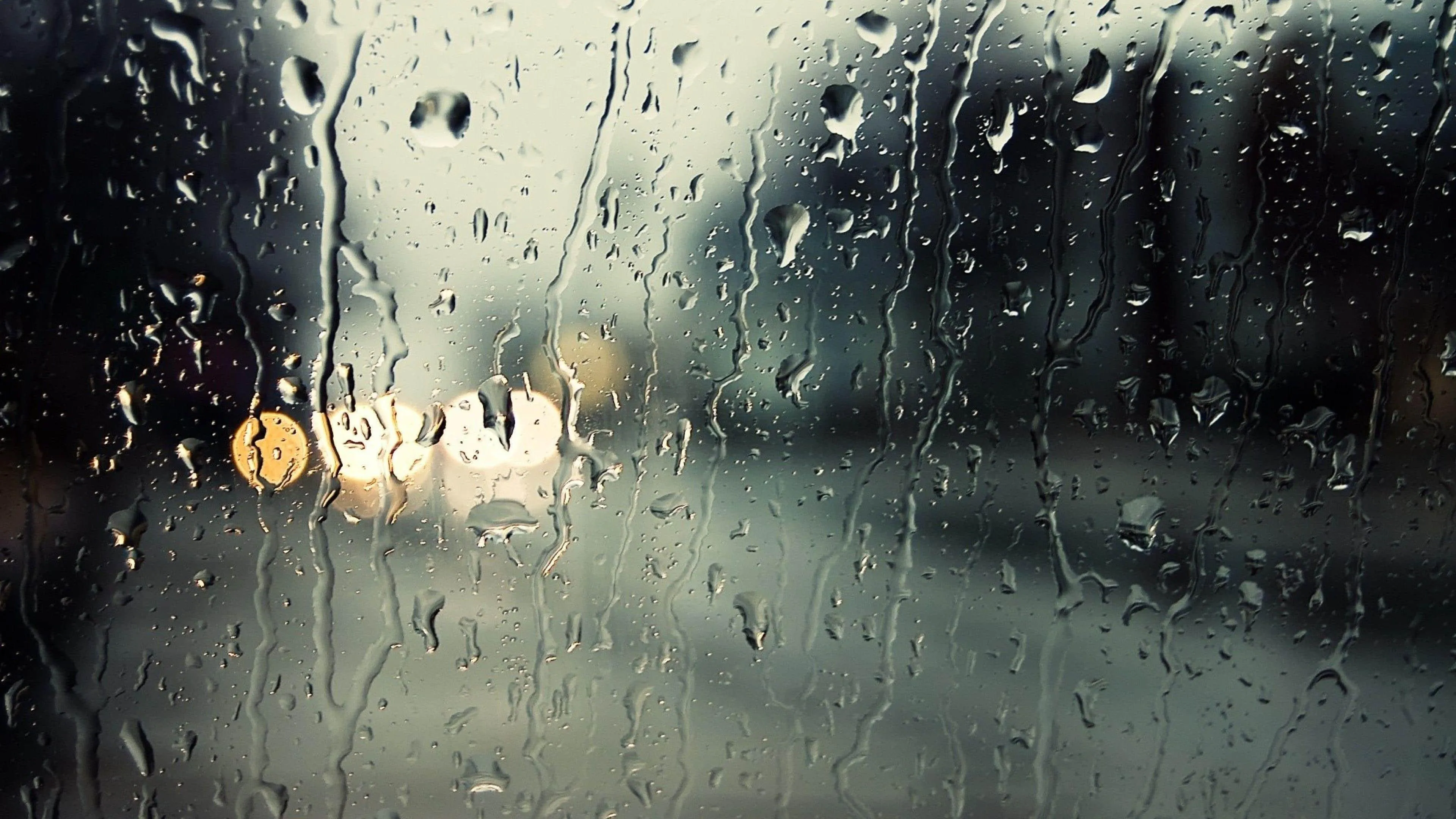 Rain Droplets on Window Pane with Soft Blurred Background
