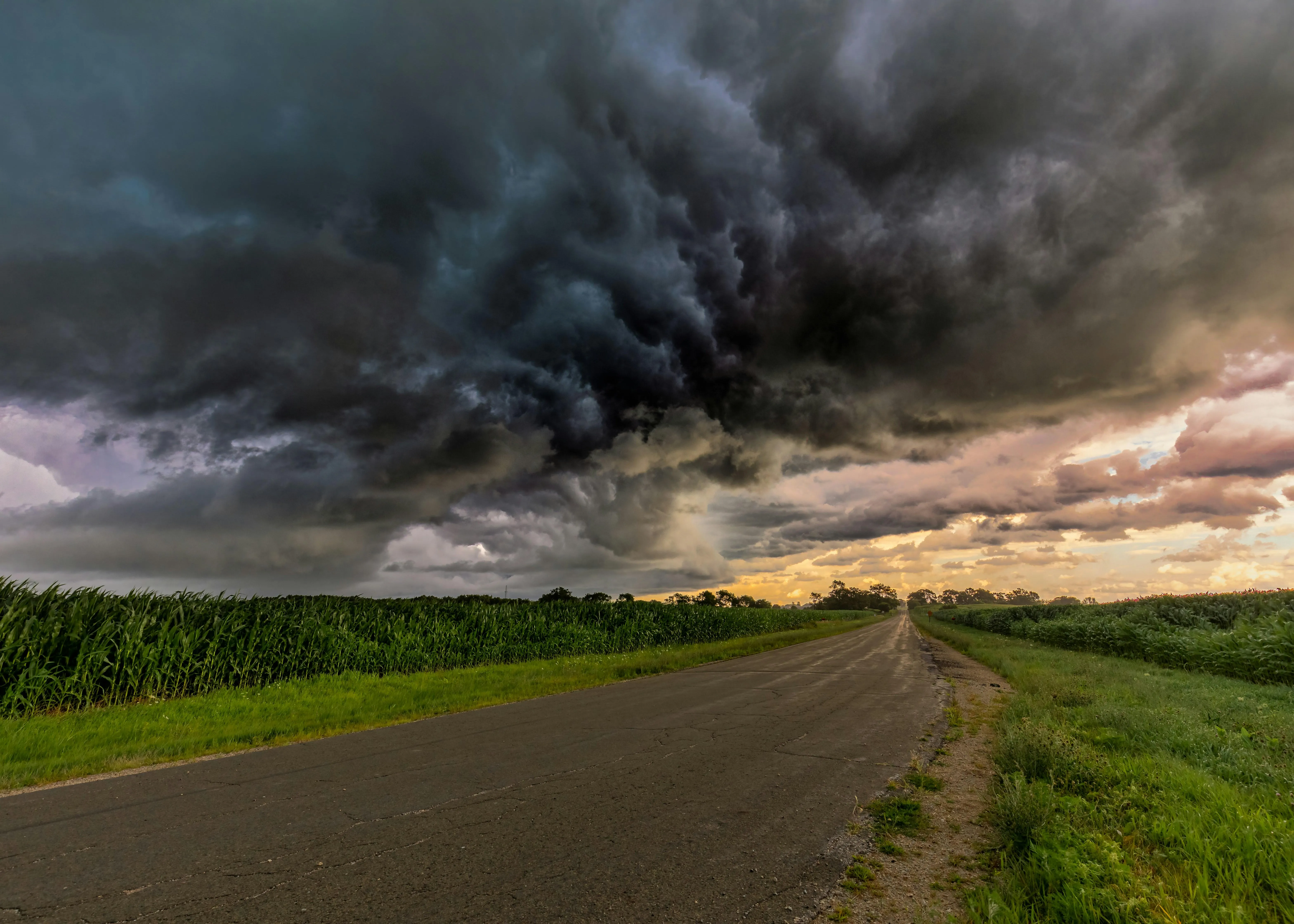 Rain Falling Over Fields and a Dark Stormy Sky Image