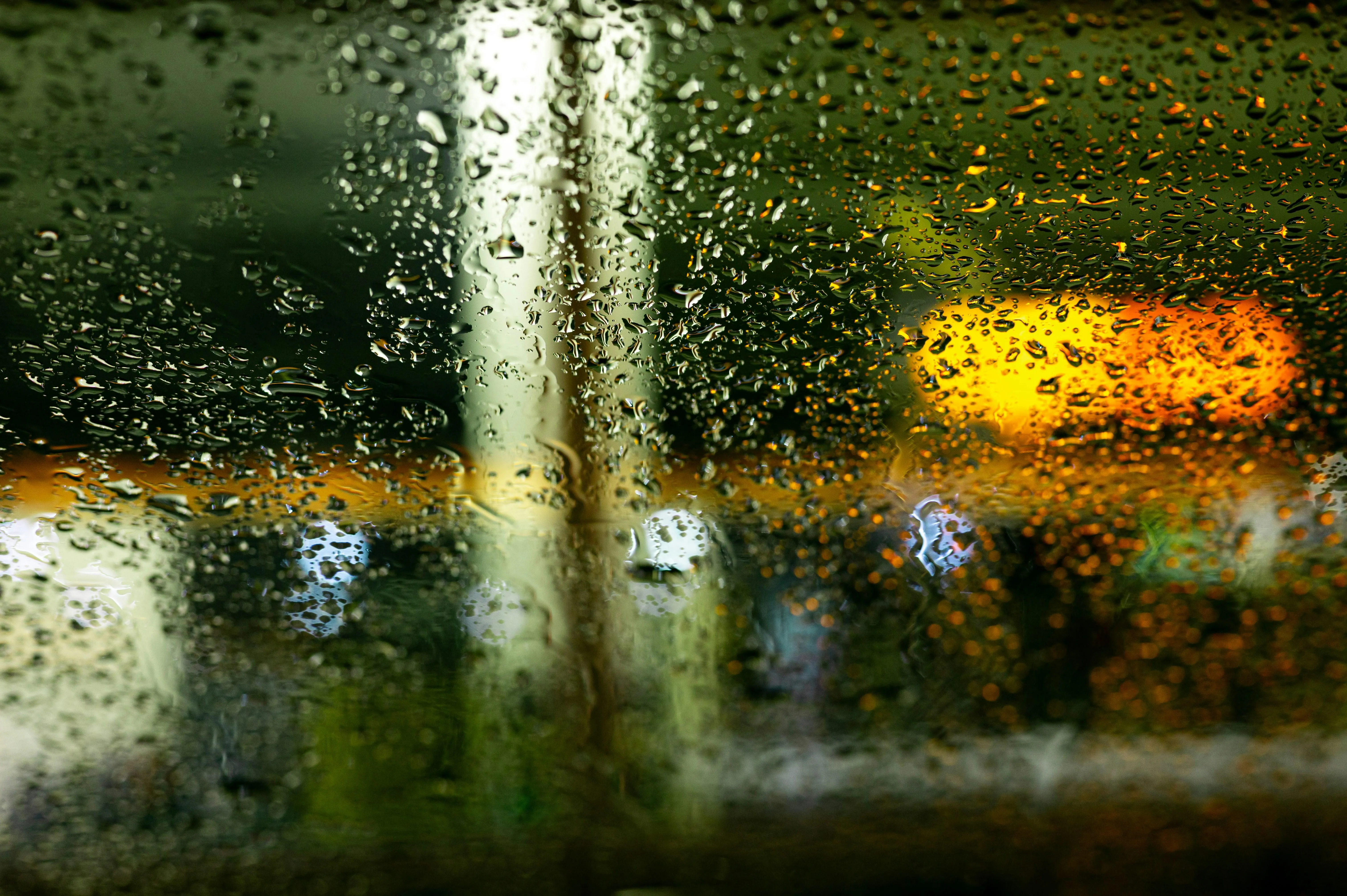 Rain Falling Over Garden Fountain in Golden Light Image