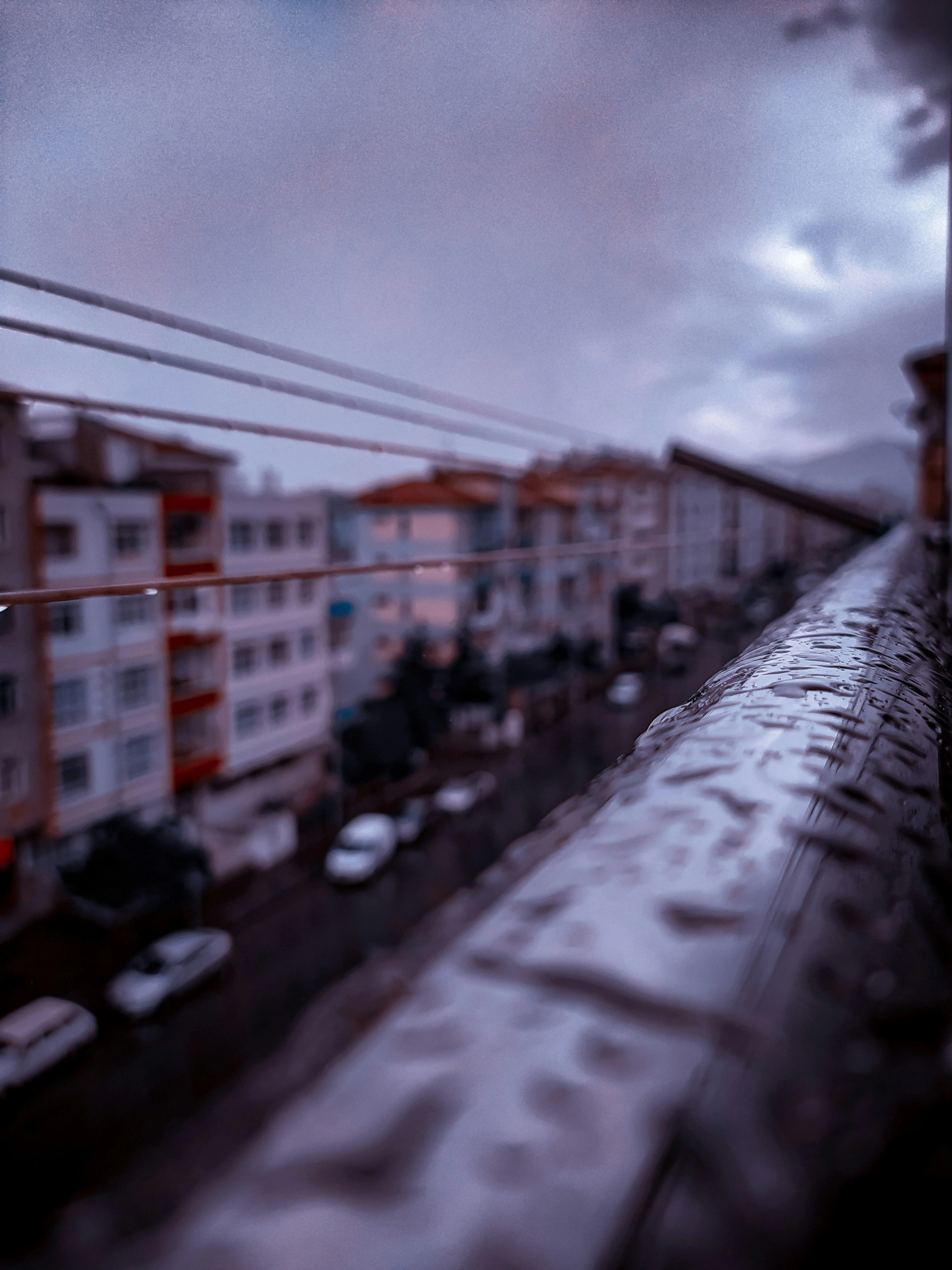 Rain on Train Tracks with Distant Train Approaching