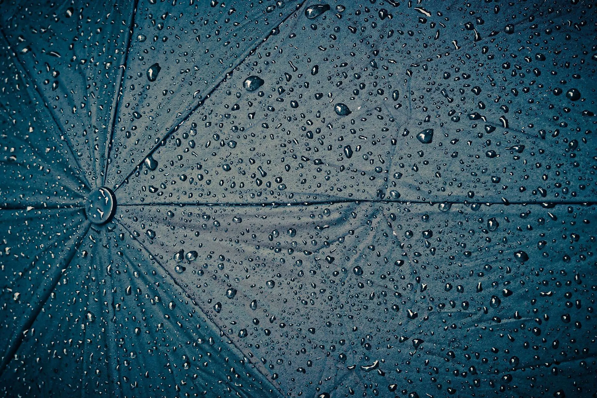 Raindrops Falling on An Umbrella Surface Wallpaper