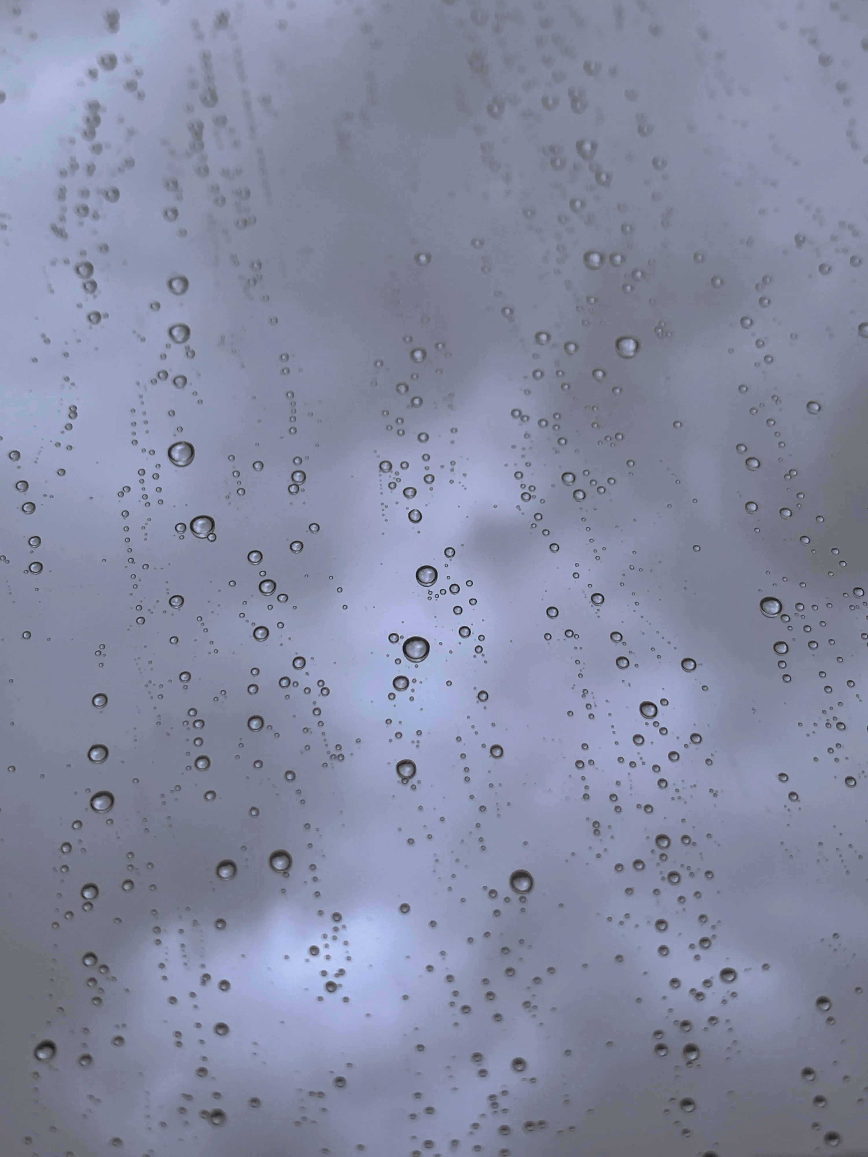 Raindrops Falling on Smooth Surface Creating Ripples