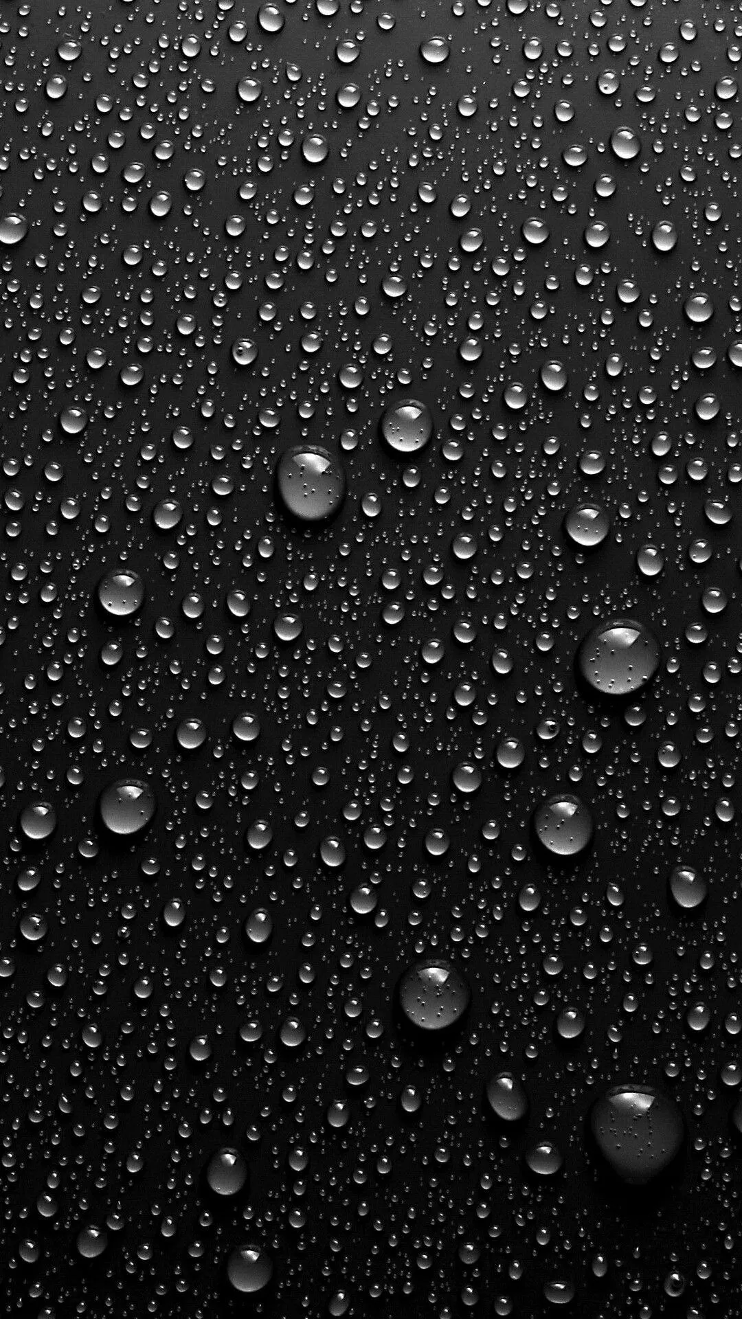 Raindrops on Dark Glass Window with Bokeh Light Effects