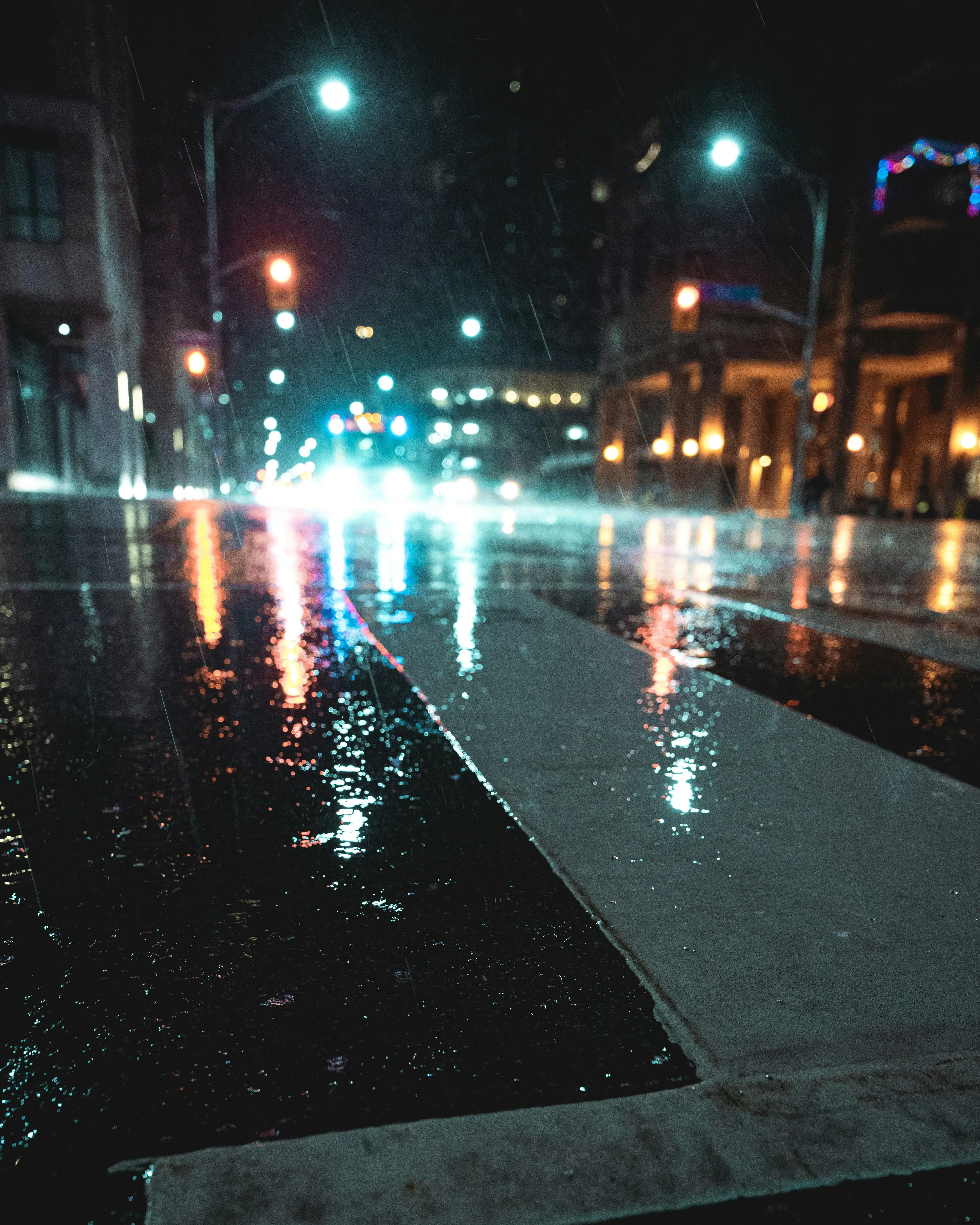 Rainy Night Street Scene with Reflections and City Lights
