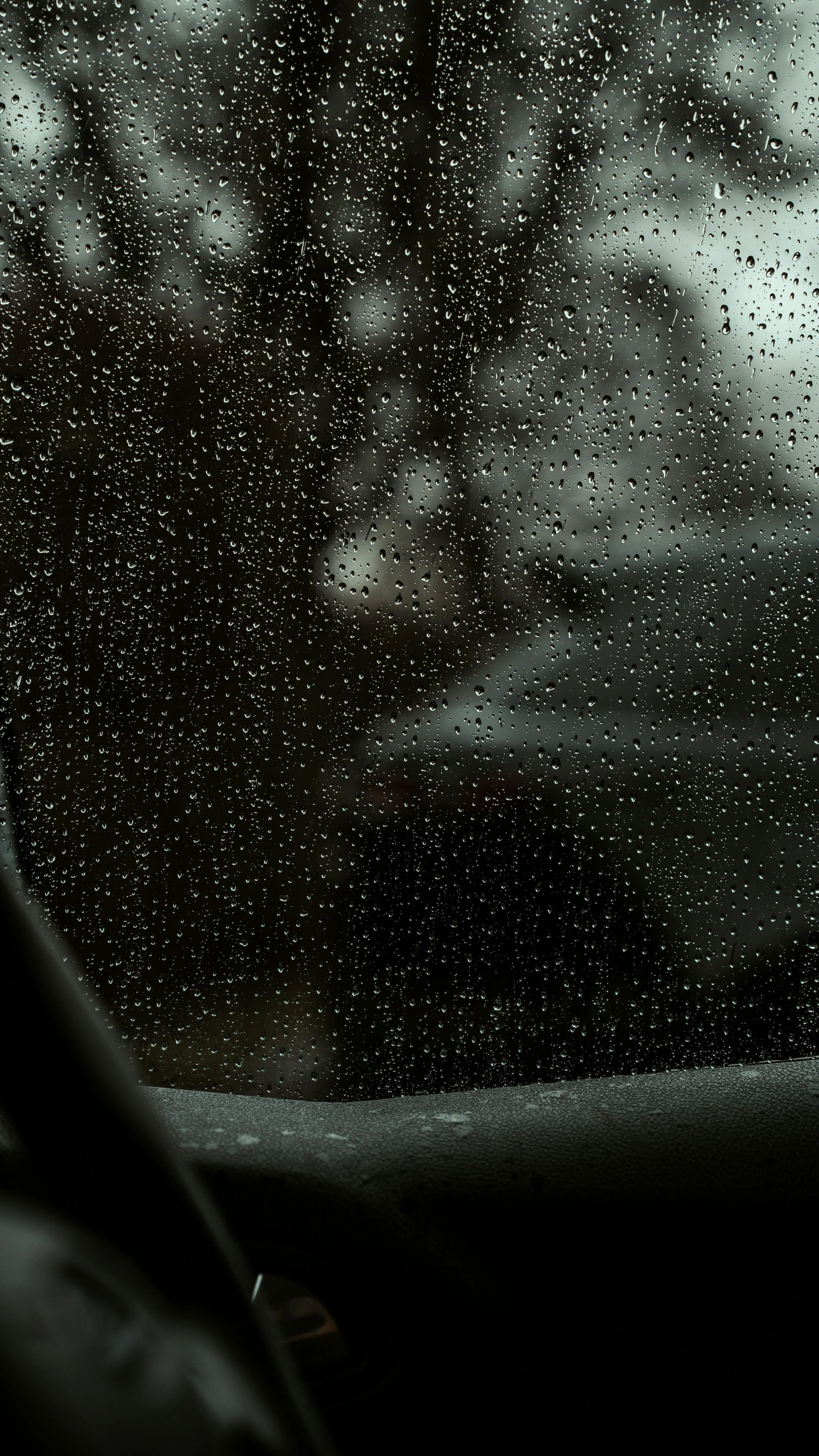 Rear View Through Wet Window During Rainy Drive Image