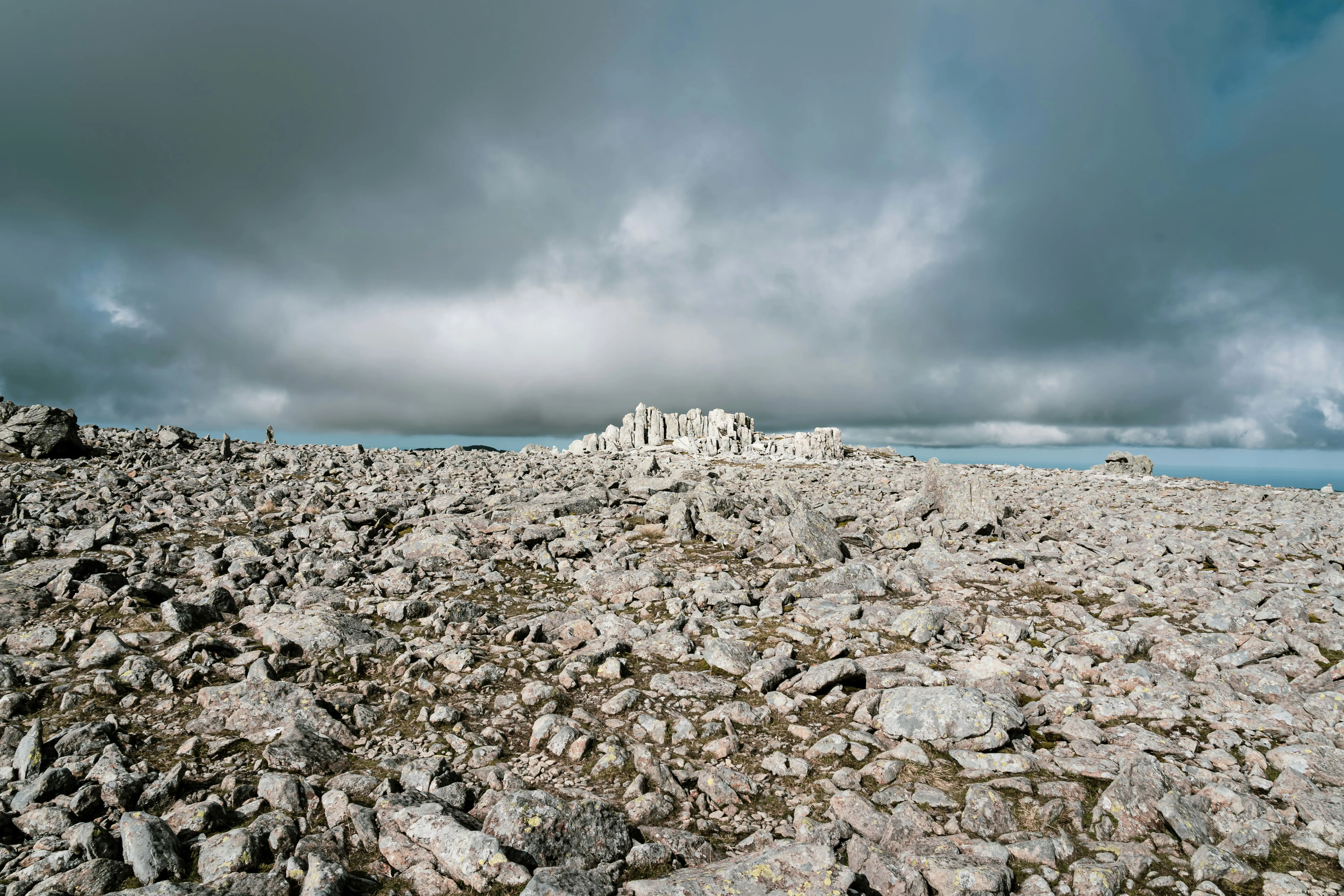 Rocky Landscape Under Cloudy Blue Sky Background HD