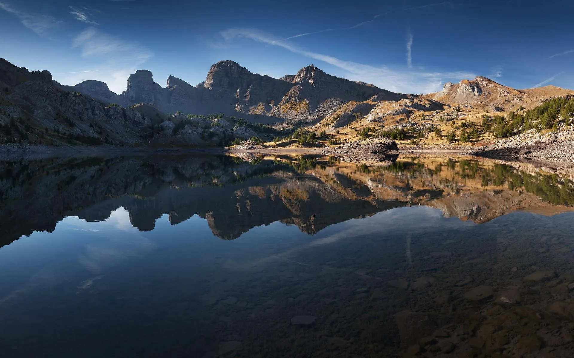 Rocky Mountain Range under Warm Sunrise Illumination