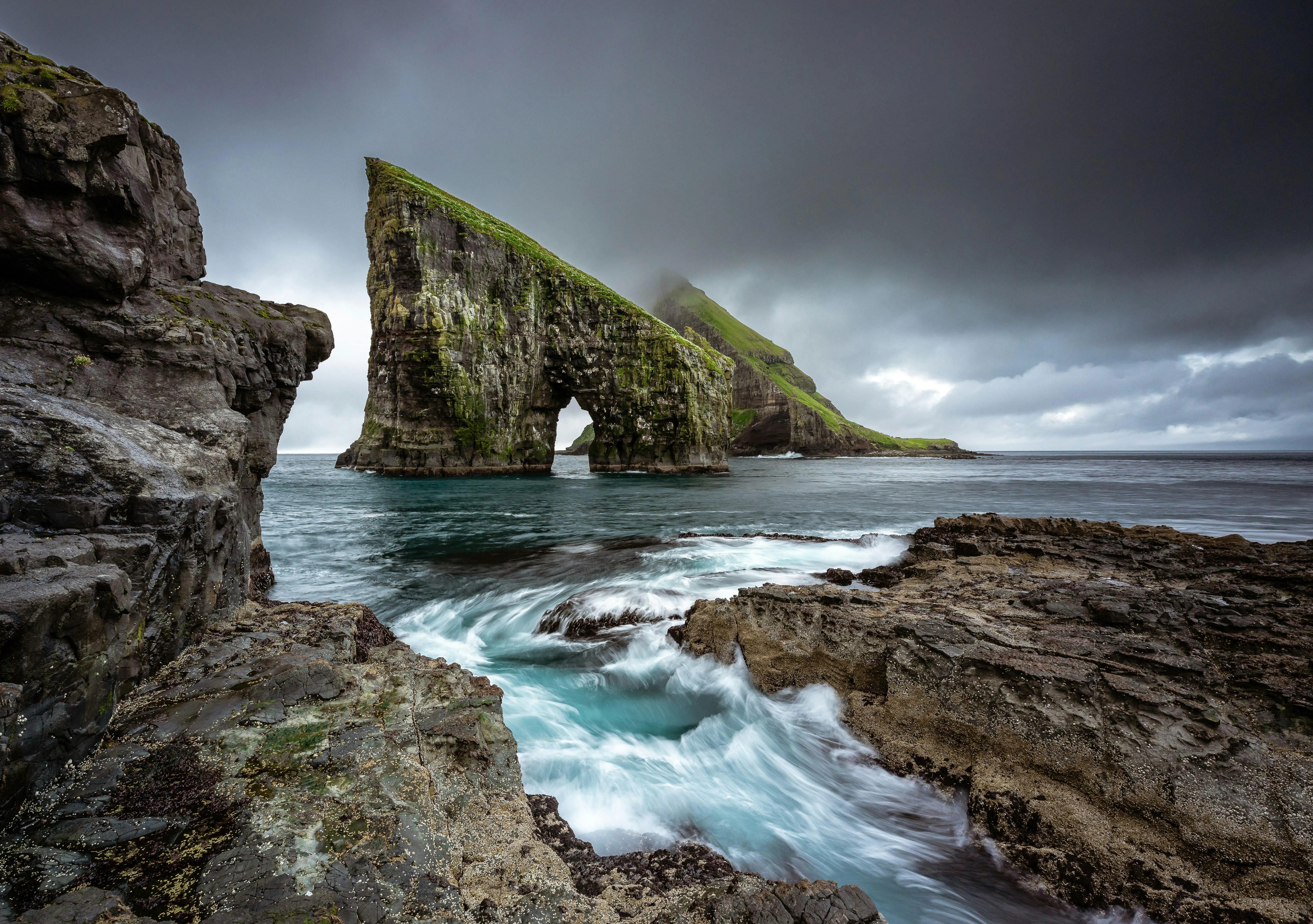 Rugged rocks with waves crashing on seaside cliffs