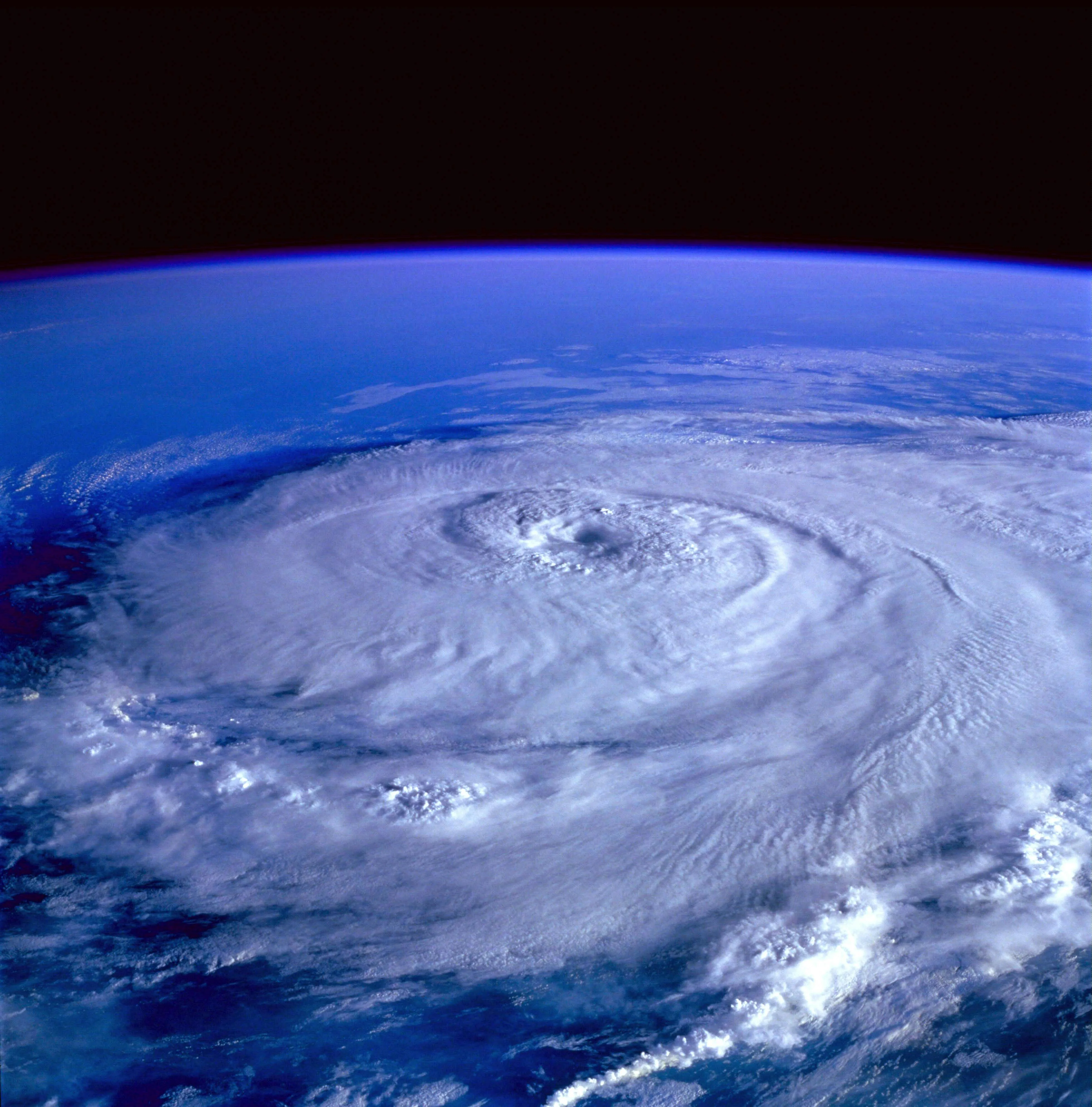 Satellite View of Massive Hurricane Swirling at Sea Wallpaper