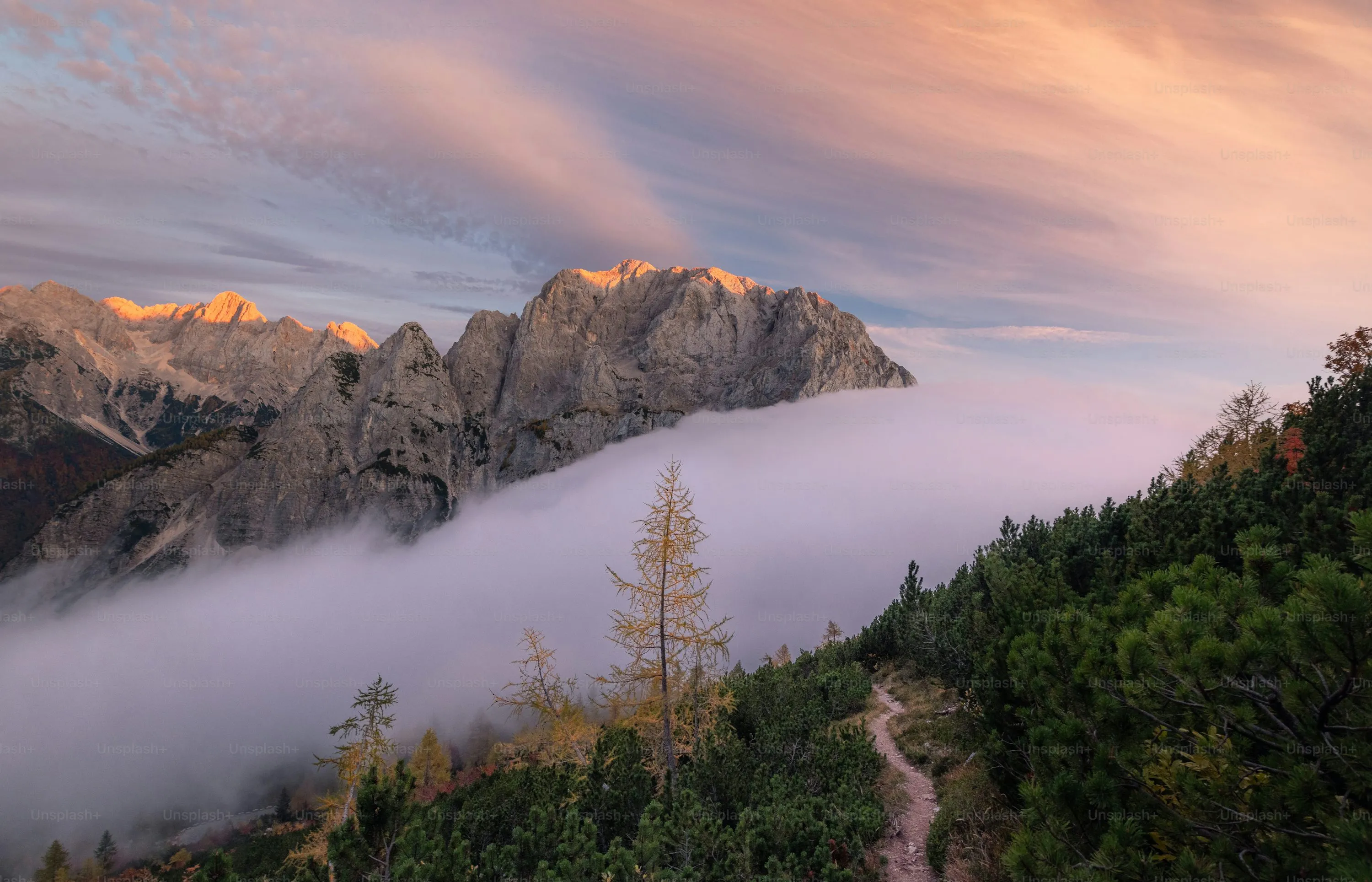 Scenic Mountain View with Morning Fog and Colorful Sky