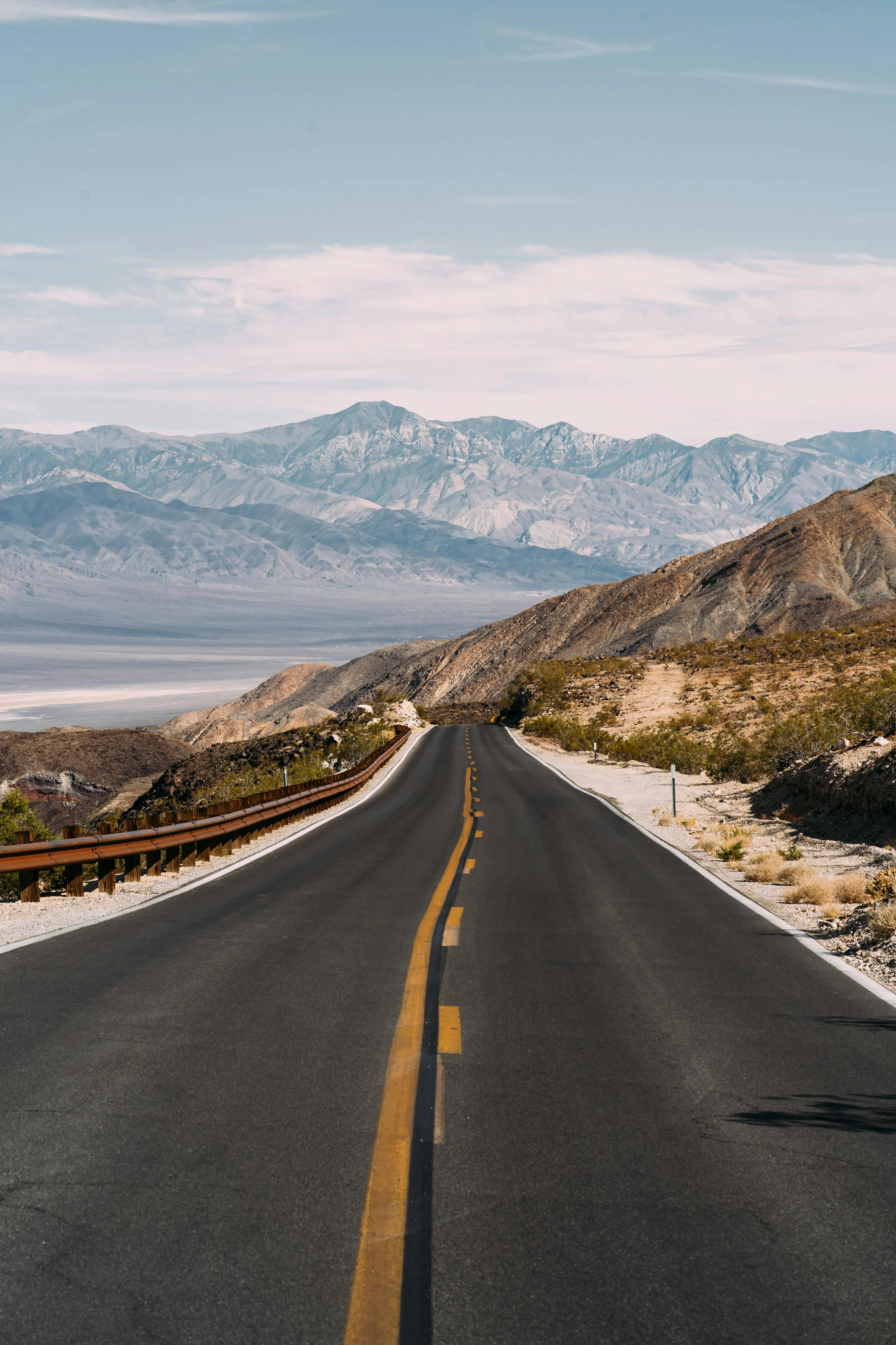 Scenic Roadway with Clear View of Snowcapped Mountains