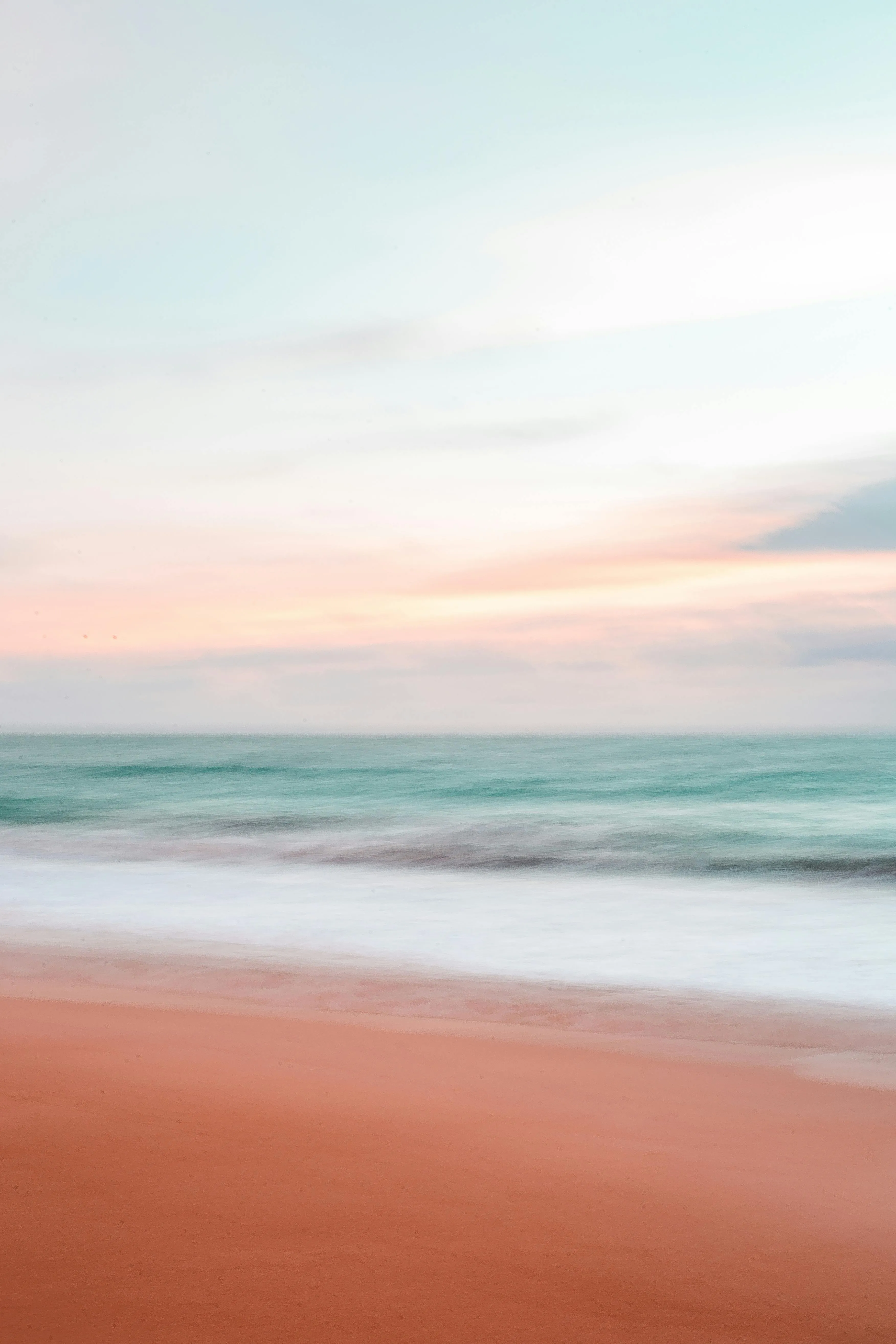 Serene Beach View with Pastel Clouds at Dusk Photography