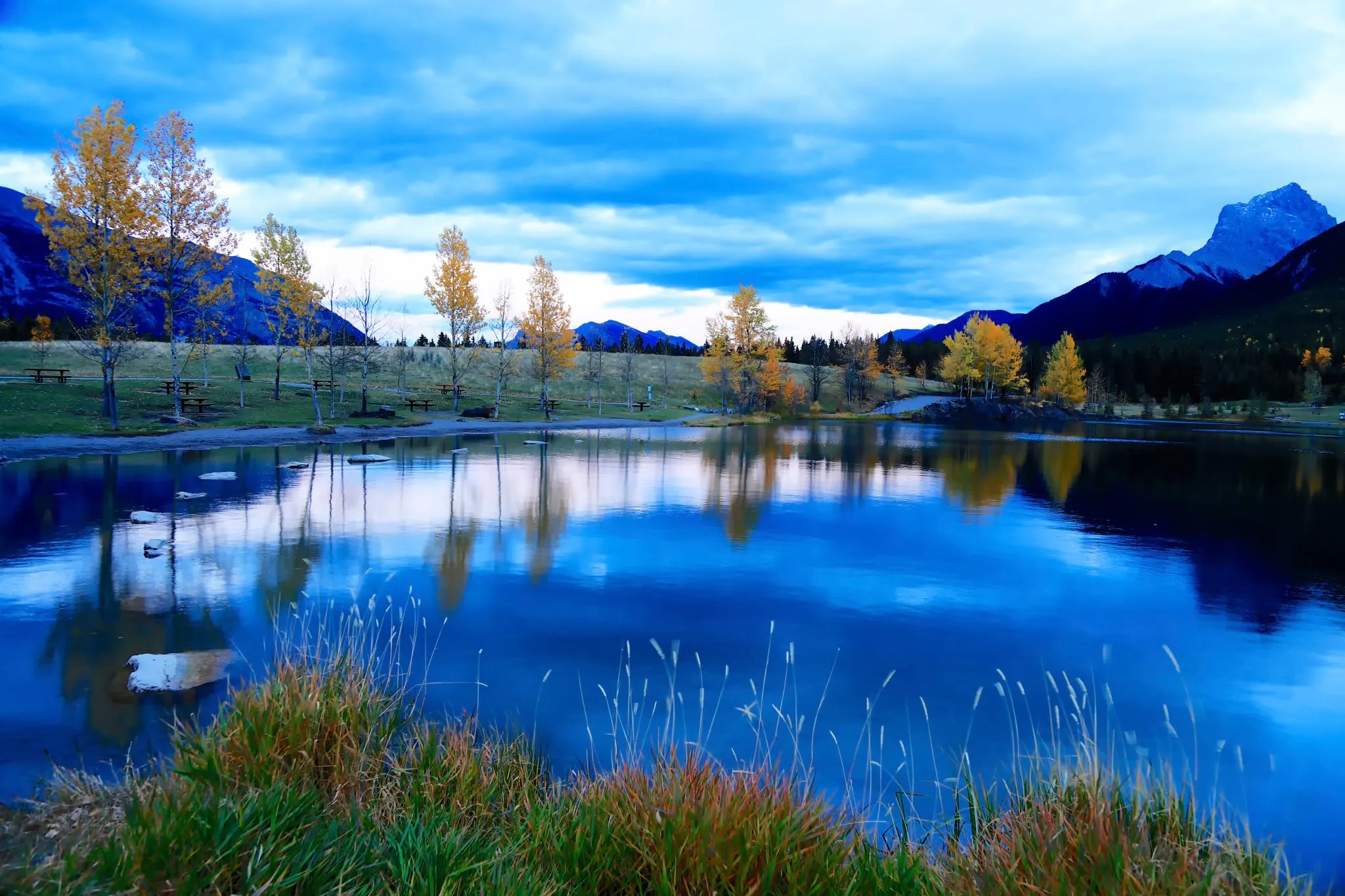Serene lake with mountains reflecting in the water