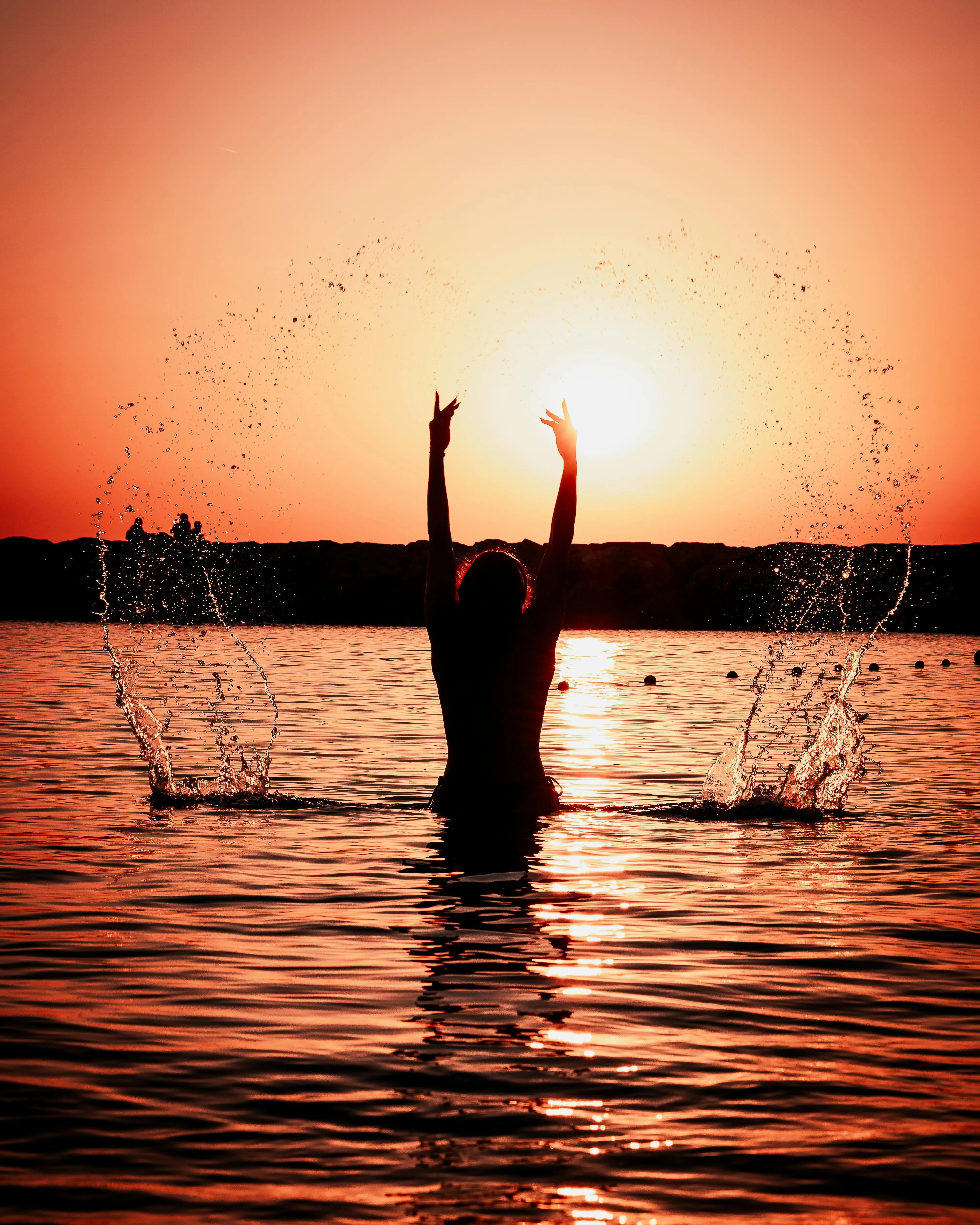 Silhouette By Ocean at Sunset During Gentle Rainfall
