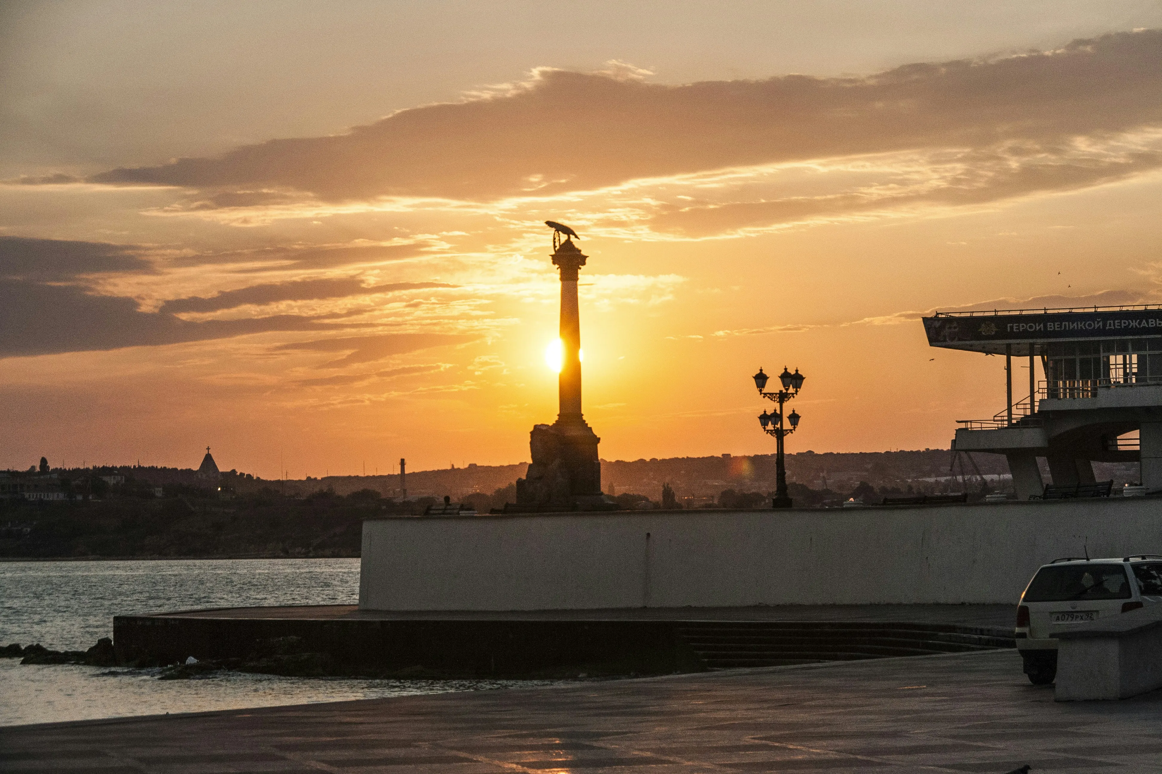 Silhouette of Monument with Orange Sky at Sunset