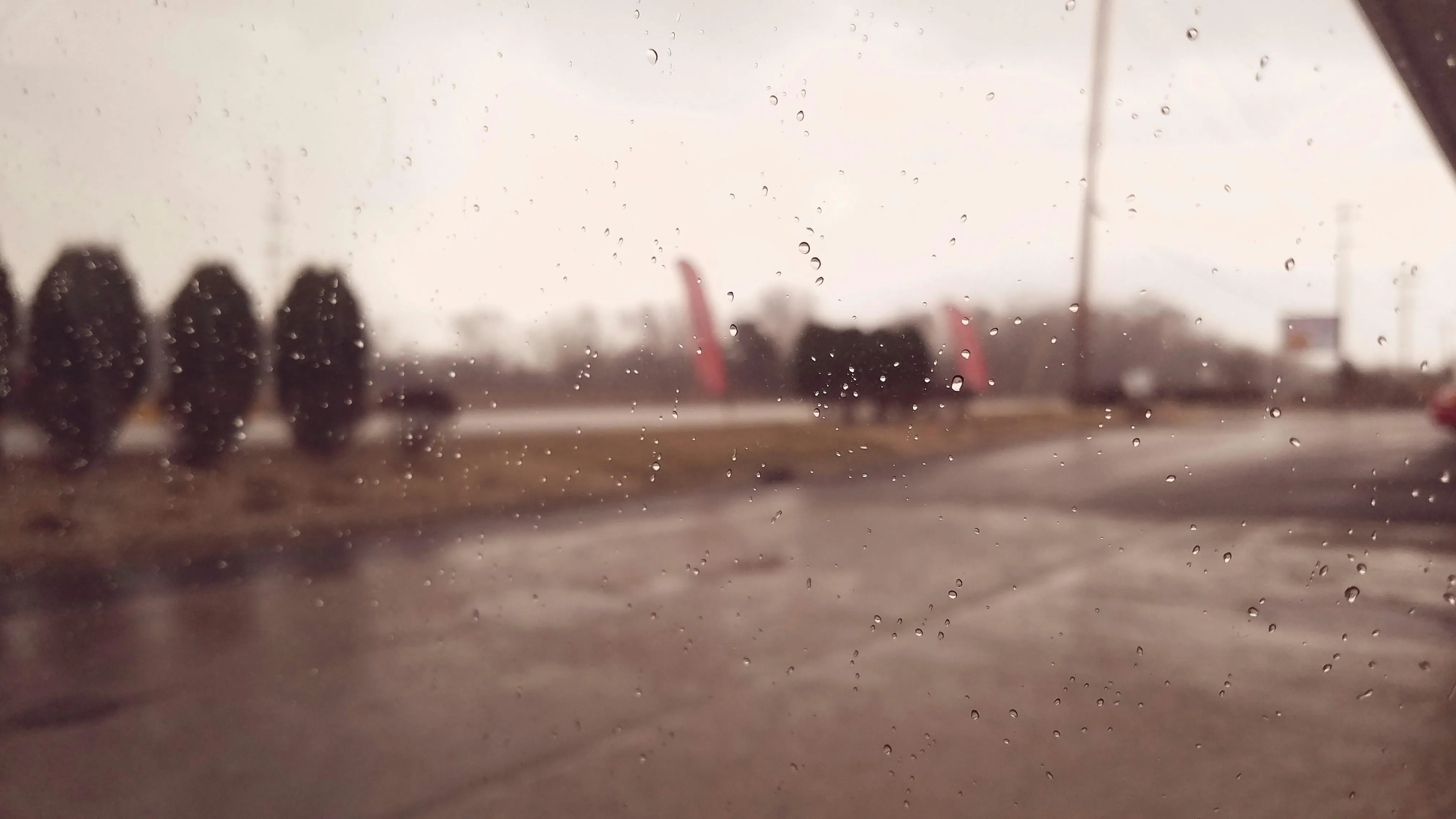 Silhouettes Walking Across Wet Bridge During Sunrise