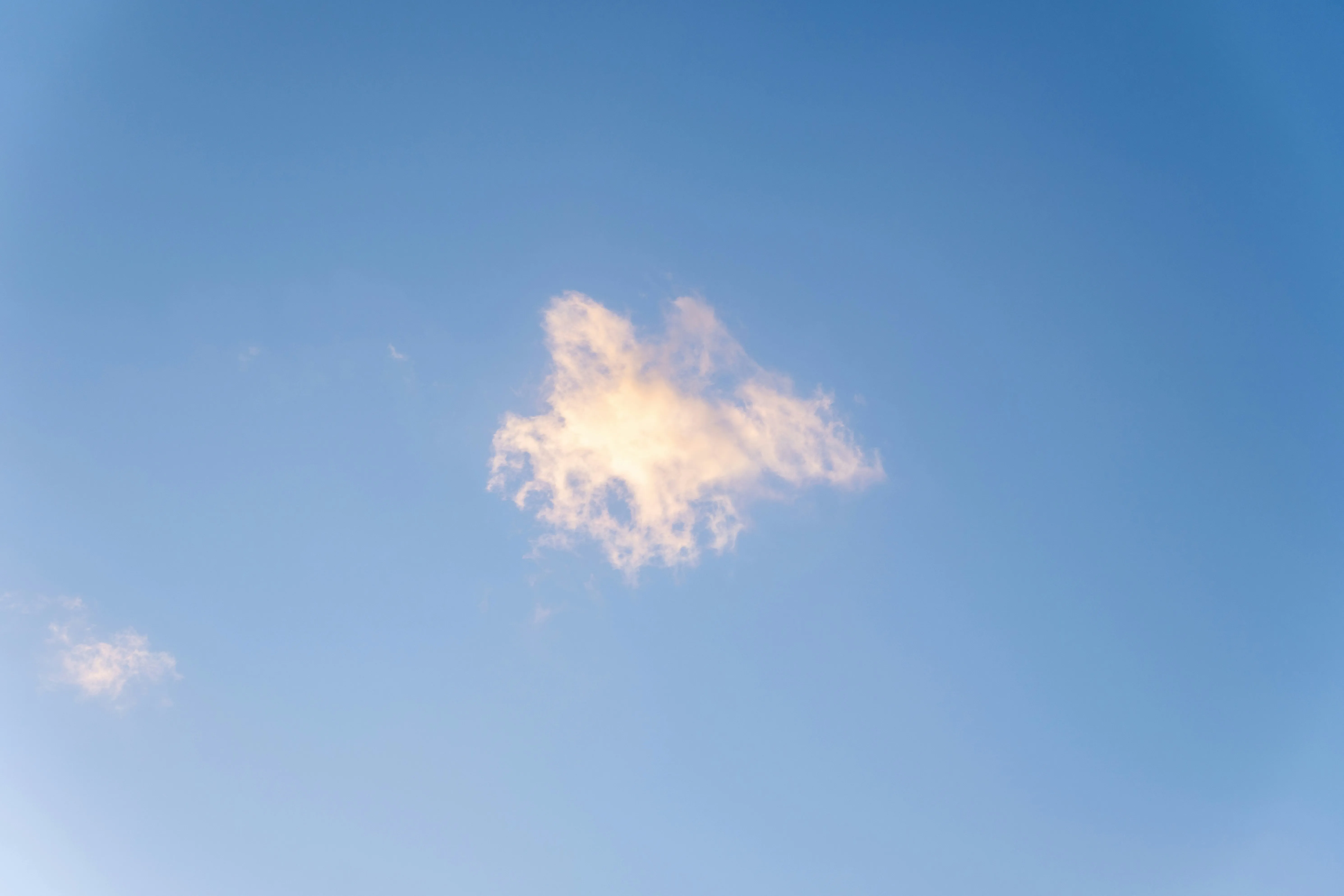 Single Small Cloud Floating in an Open Blue Sky Wallpaper