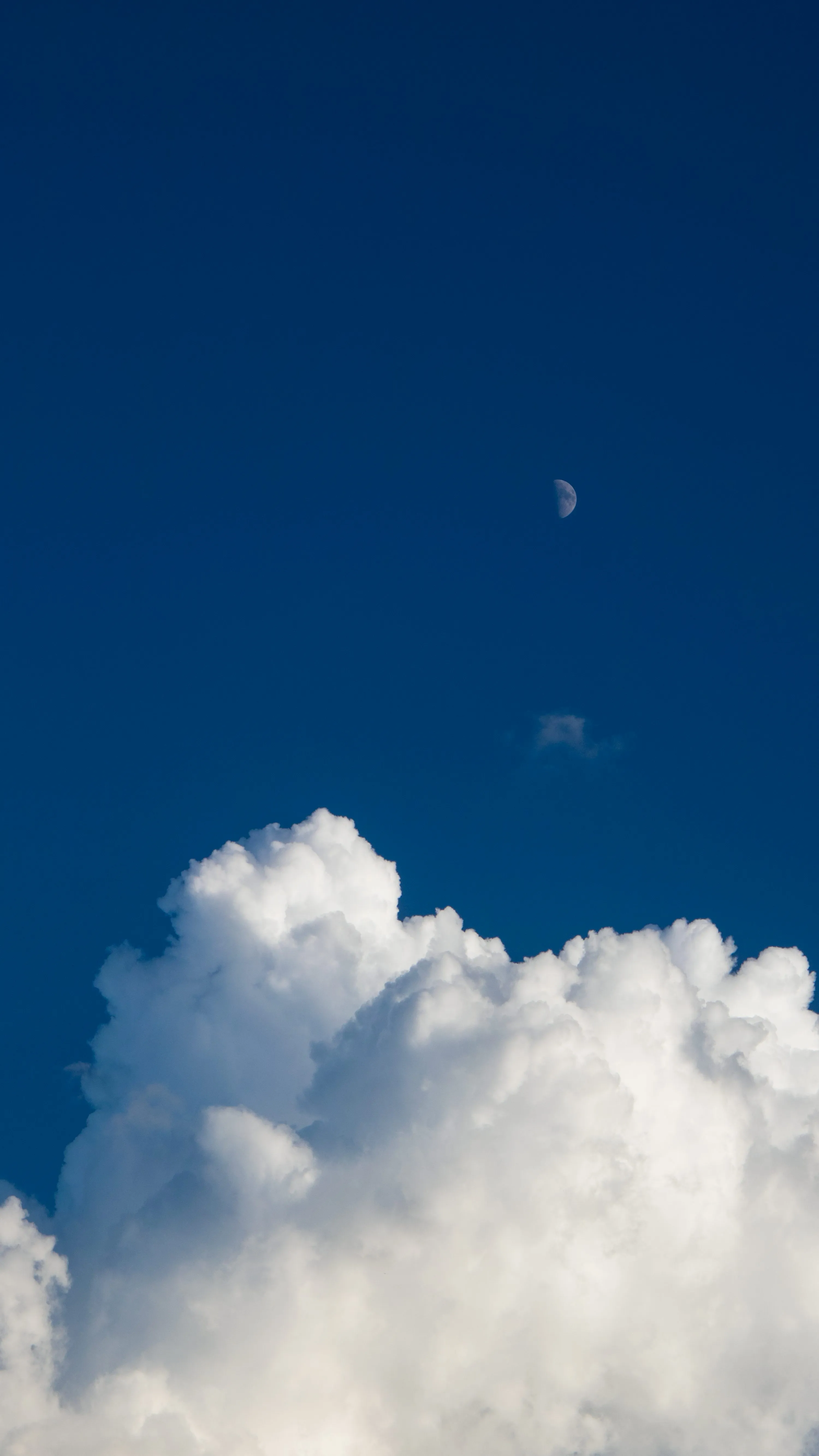 Small Fluffy Cloud Against Deep Blue Clear Sky Wallpaper