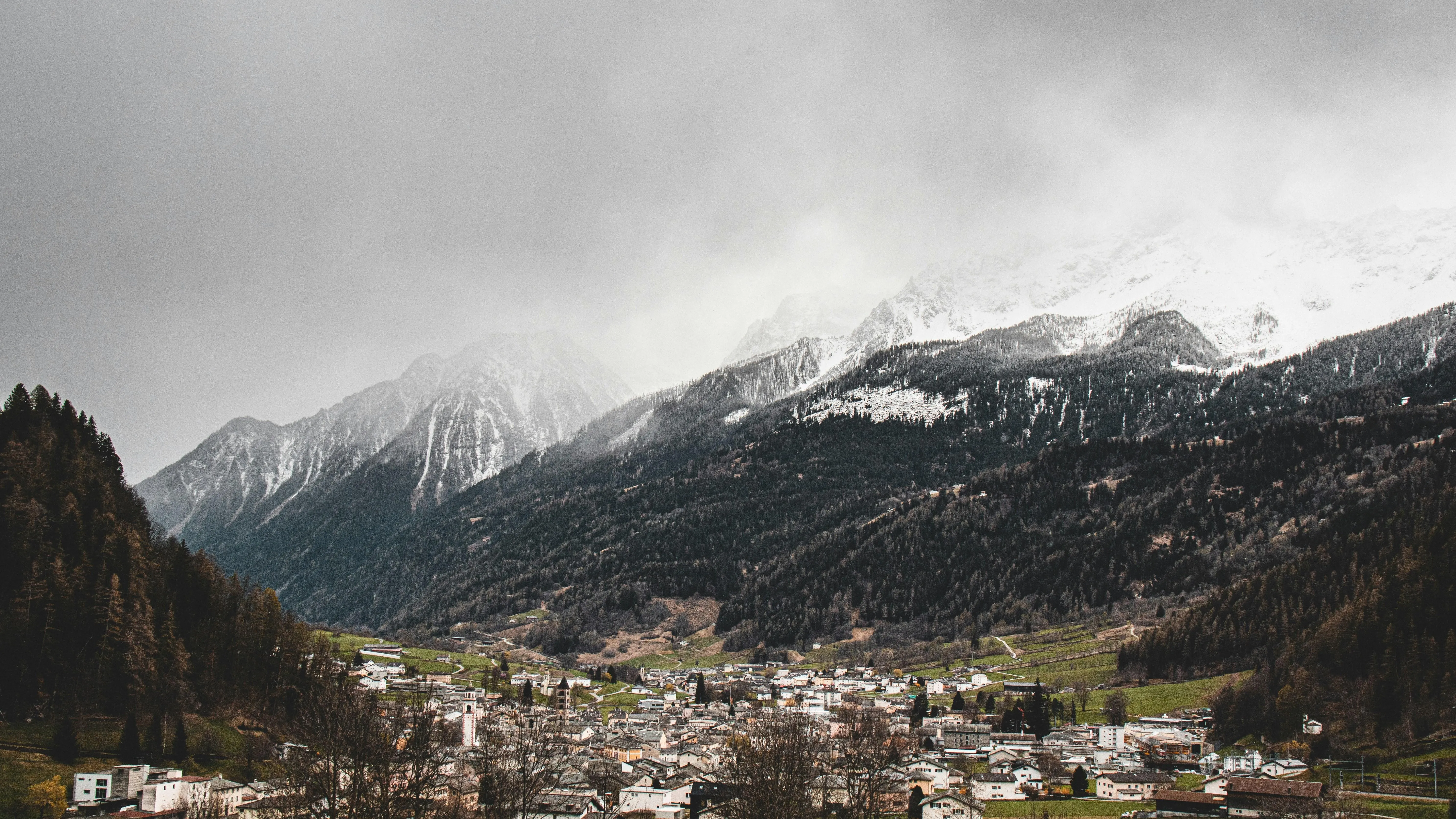 Snow capped mountains under cloudy sky view free image